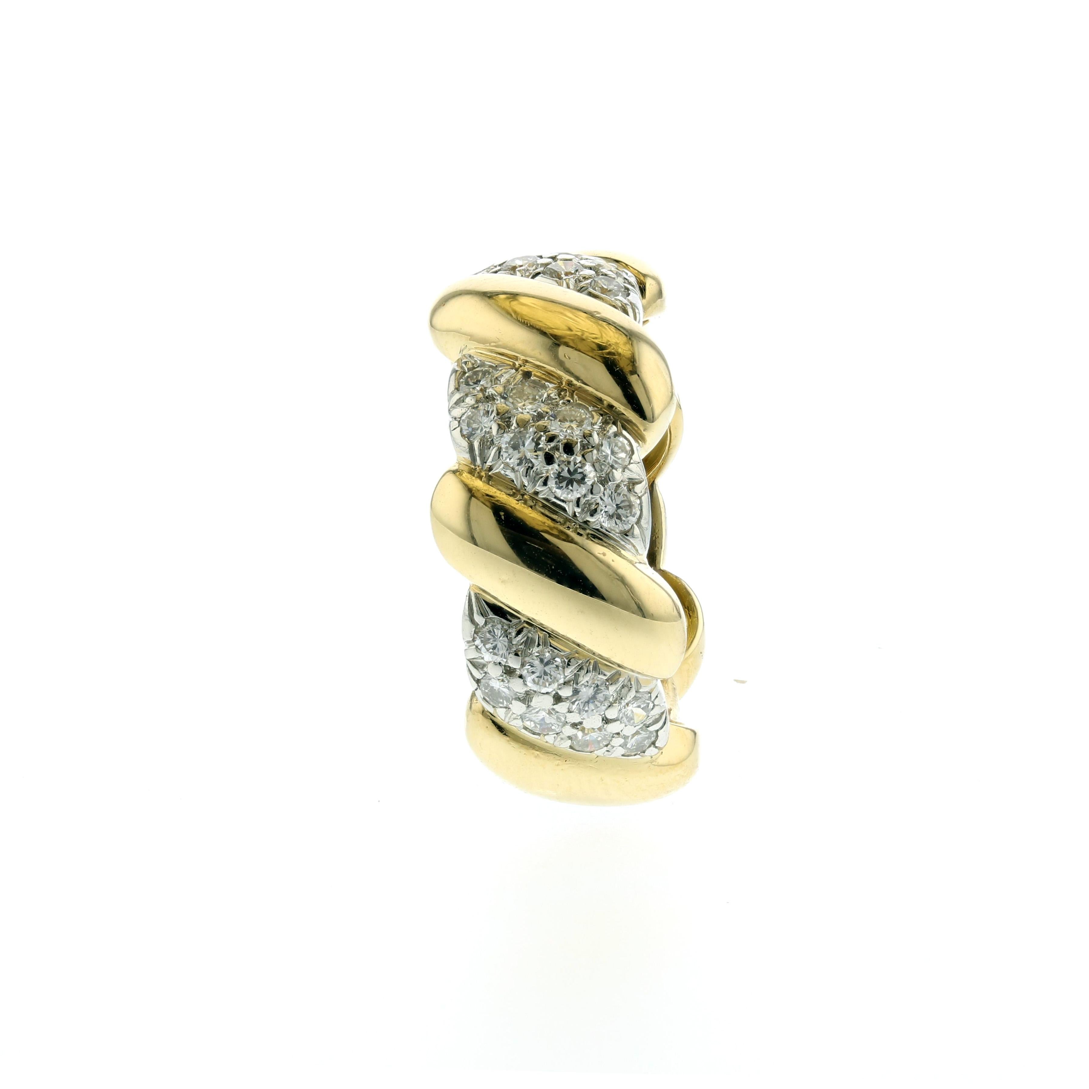 David Webb band in 18K yellow gold with diamonds set in platinum.   The ring has forty-eight round brilliant-cut diamonds weighing  1.45 carats; F-G color and VS-SI1 clarity.  Ring measures 7/16 inches wide.