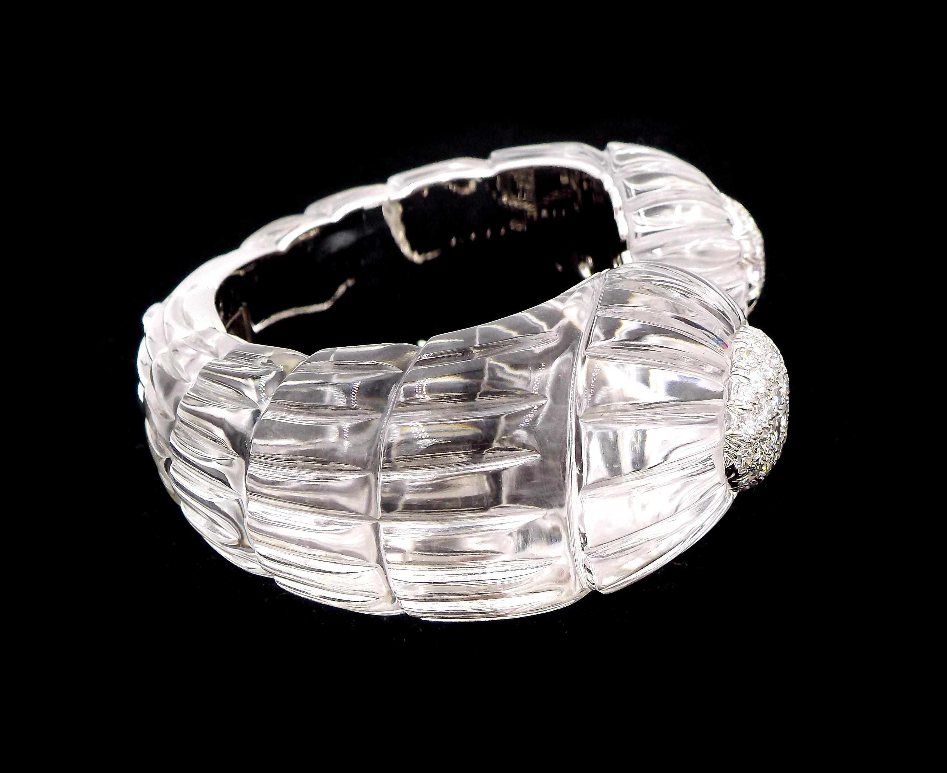 An elegant rock crystal cuff bracelet from the Twilight collection made by David Webb. Featuring carved rock crystal, approx. 5.90ct of brilliant-cut diamonds, set in 18K white gold and platinum. Inner circumference is approx. 6.25 inches. Signed
