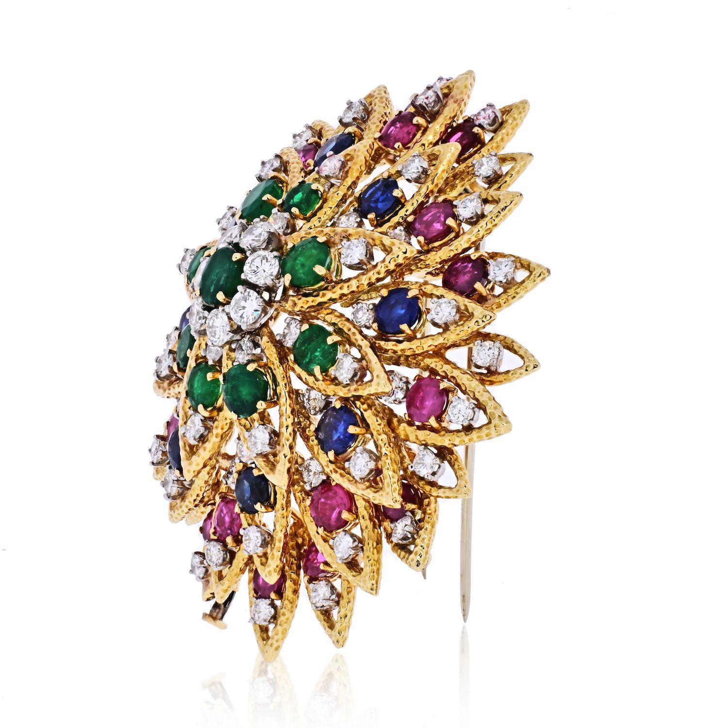 A spectacular brooch crafted in 1970's by David Webb. This is a multicolor gemstone brooch set with diamonds, emeralds, rubies and sapphires.Set with 69 White Round Diamonds, 9 Green Emeralds, 8 Sapphires, and 16 Rubies this is an impressive