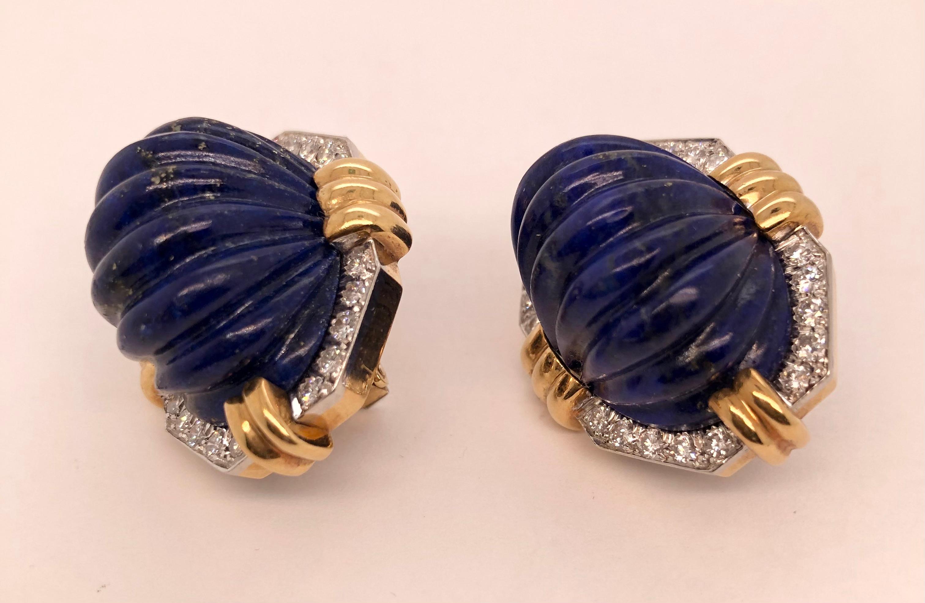 Beautiful 1980' David Webb 18K gold and platinum diamond carved lapis earclips fitted with posts. Set with 40 diamonds approx 2.40cts. approx E - F color VS clarity. 
Measurment: 32.7mm x 26.2mm x 26.8mm
Weight: 43.0g
Marked: WEBB, 18K, PLAT