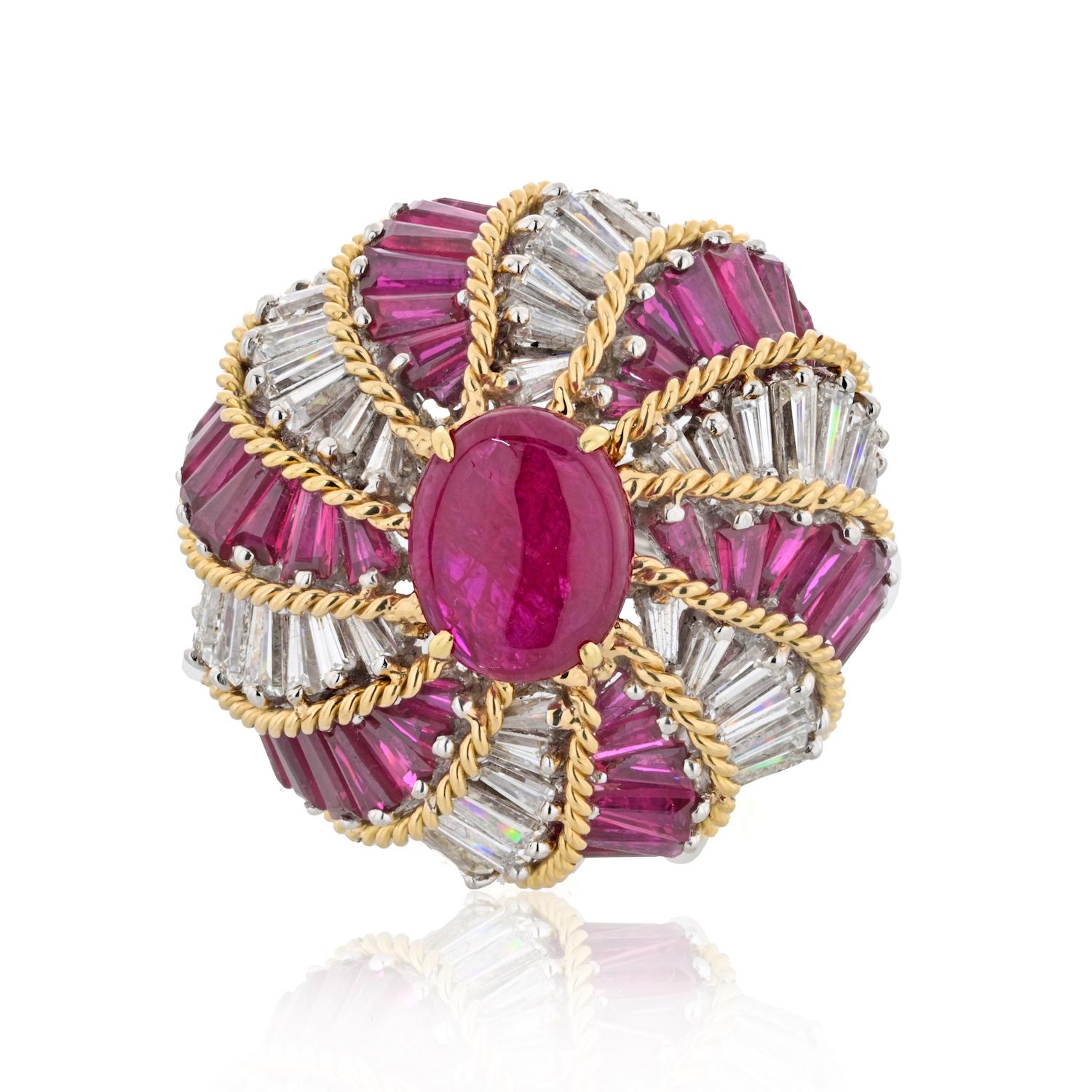 Step into a world of opulence and artistry with the David Webb Turban Diamond and Ruby Ring, a mesmerizing masterpiece in platinum and 18k yellow gold. At its heart, a resplendent center ruby measuring approximately 11mm x 9mm, boasting a