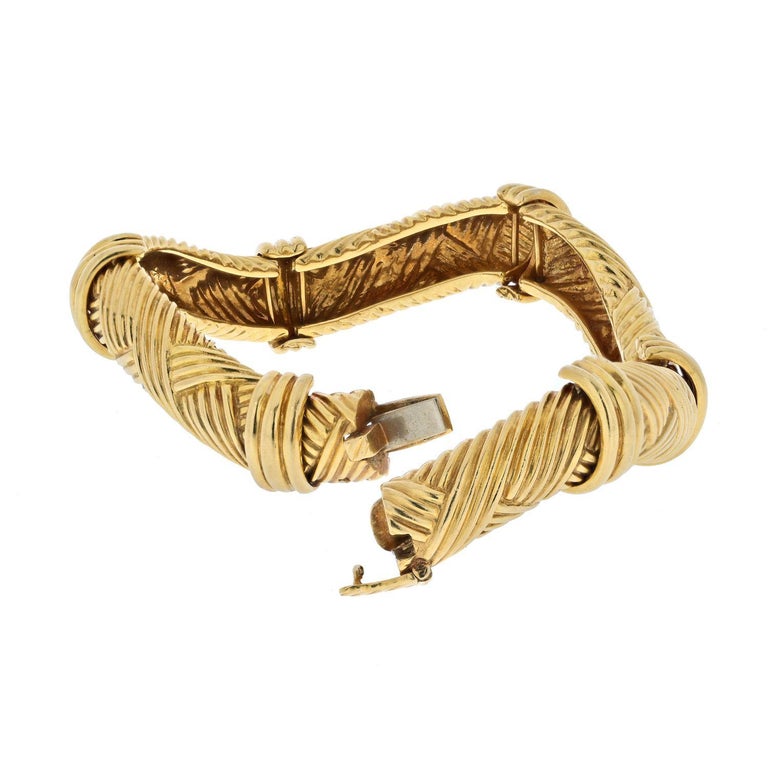 David Webb 18K Yellow Gold Articulated Twisted Ribbed Bangle Bracelet at  1stDibs | jenna lyons bracelet, cuff bracelet spring hinge mechanism, jenna  lyons gold bracelet
