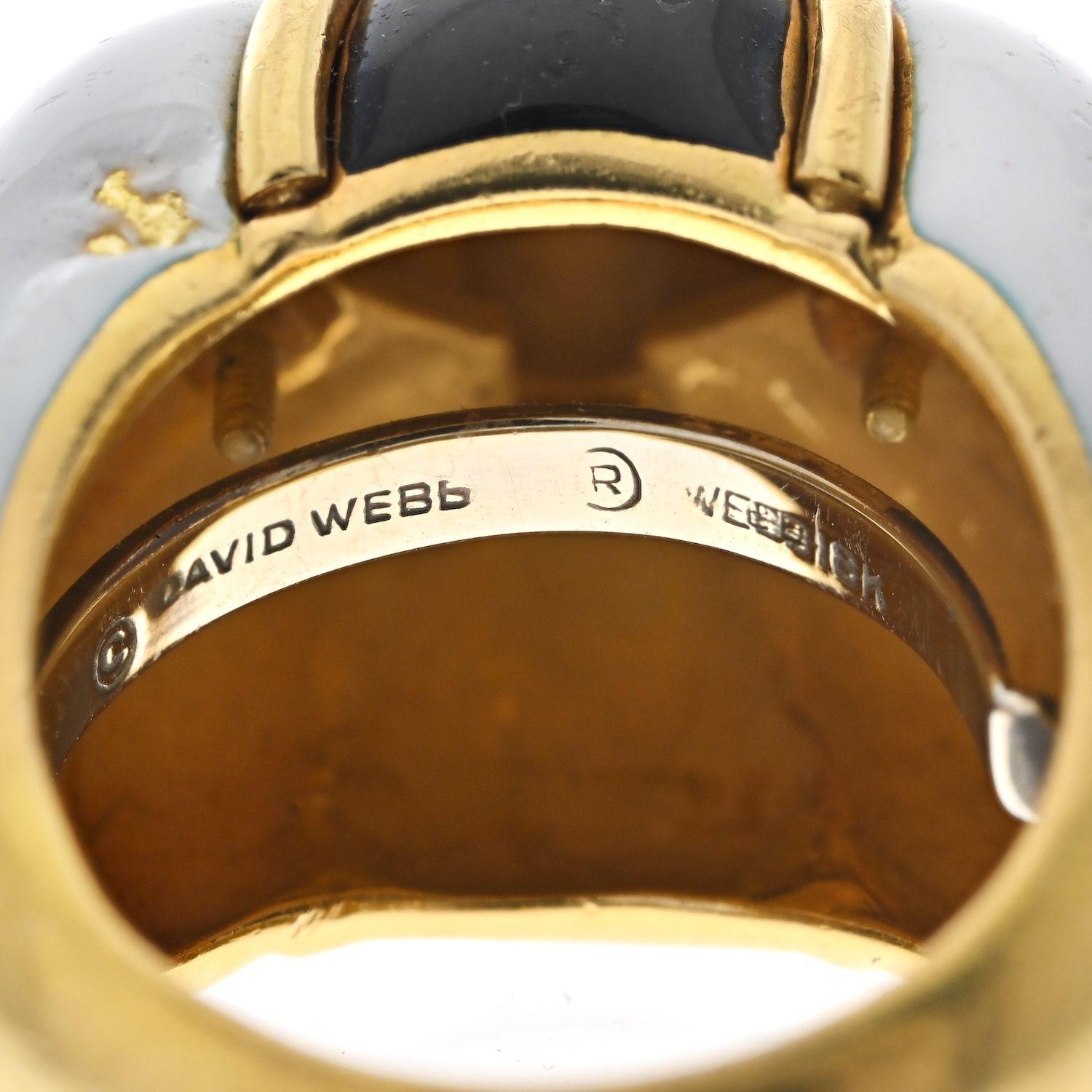 David Webb is known for his fun bombe rings. This one is no exception: decorated with alternating black and white stripes and gold arches contouring each section. 
Some enameling is missing as well as one of the gold arches. 
Overall good condition,