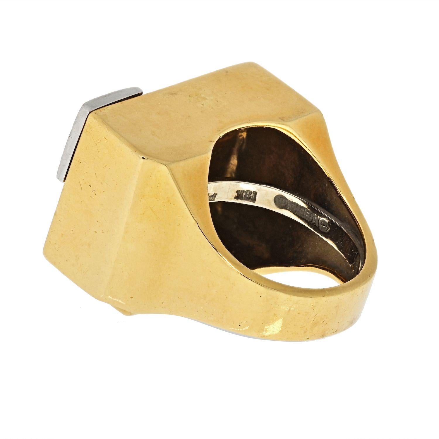 This is a vintage ring by David Webb, with black enamel and white diamonds crafted in 18k yellow gold, mounted with round brilliant cut diamonds. 
Overall top width: 19mm
Overall top length: 26mm
With the platinum sizing spring inside for easy size