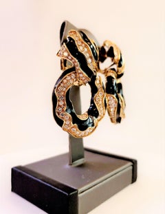 David Webb, orecchini a clip in oro giallo 18 carati e smalto nero con diamanti