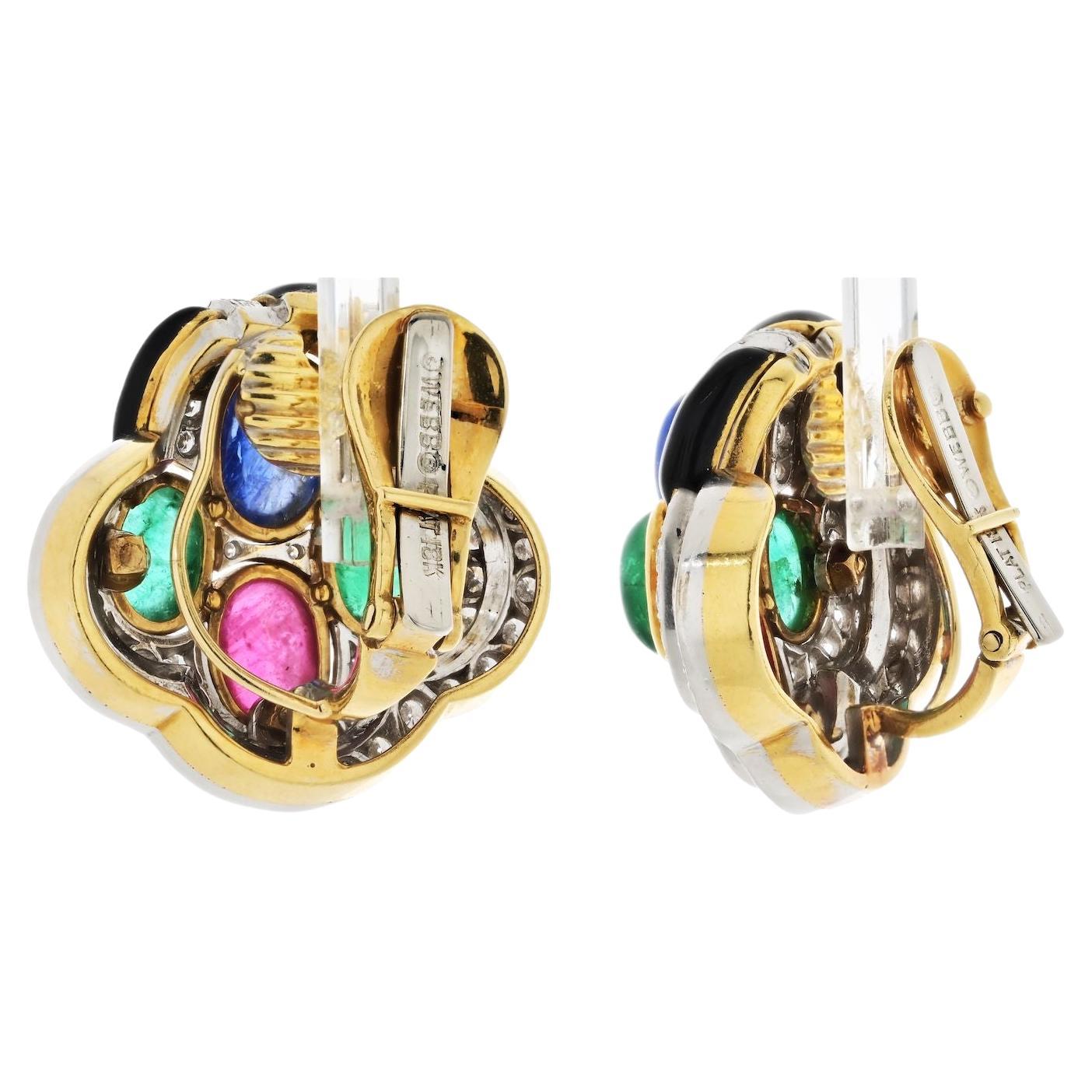 These David Webb earrings are a stunning example of the brand's exquisite craftsmanship and attention to detail. Measuring at about 3cm in length, they are crafted in 18k yellow gold, giving them a luxurious and timeless appeal. The earrings are