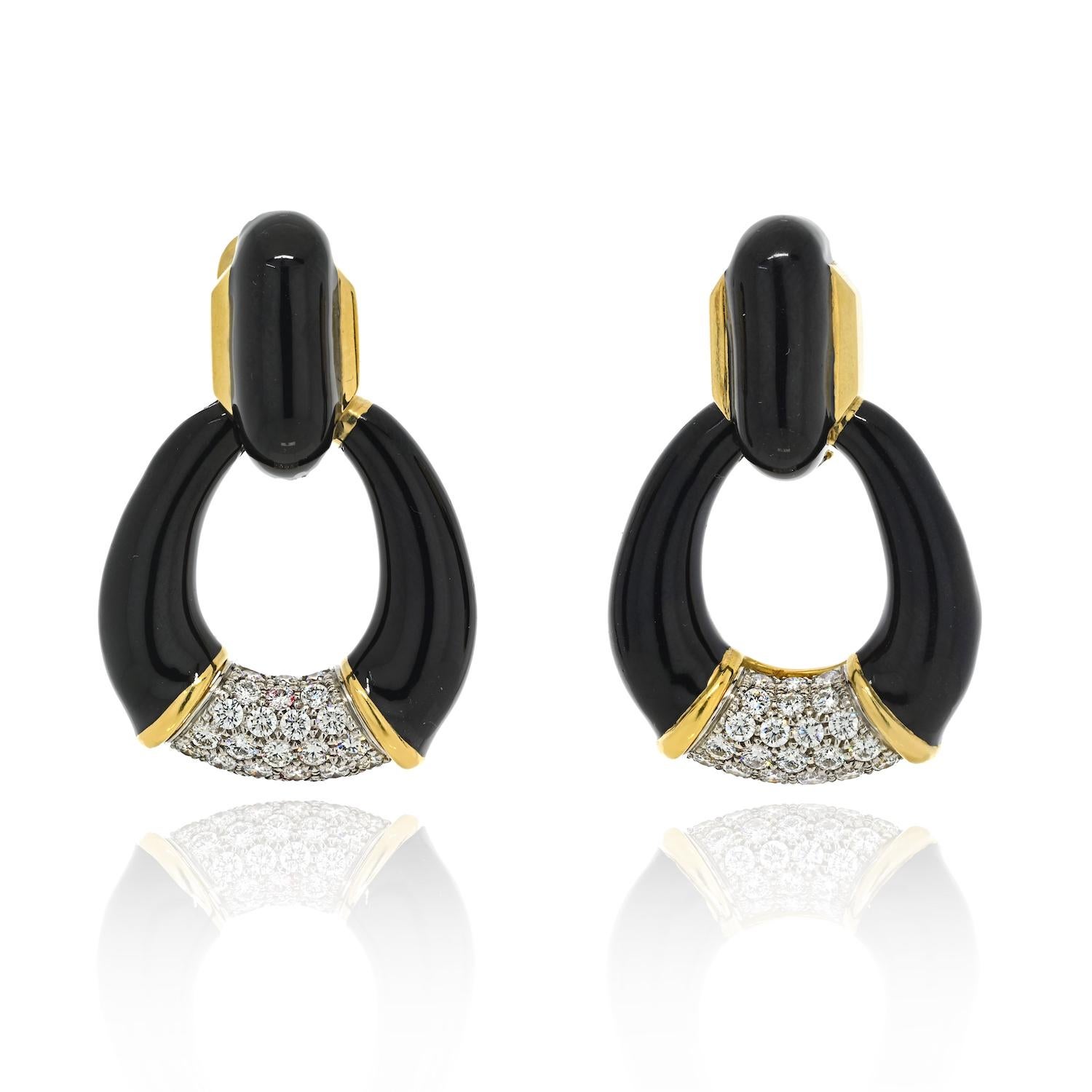 Prepare to make a bold and glamorous statement with these exquisite David Webb door knocker earrings. Crafted in 18k yellow gold and platinum, these earrings embody the iconic style and artistry for which David Webb is renowned.

The door knocker