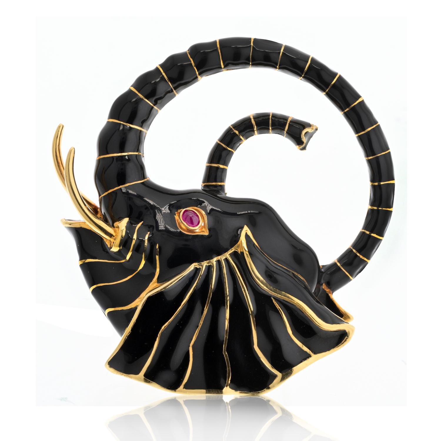 Indulge in the majestic allure of the David Webb Platinum & 18K Yellow Gold Black Enamel Elephant Brooch. This exquisite piece of wearable art is designed as a masterful fusion of black enamel and sculpted 18k gold, capturing the regal essence of an