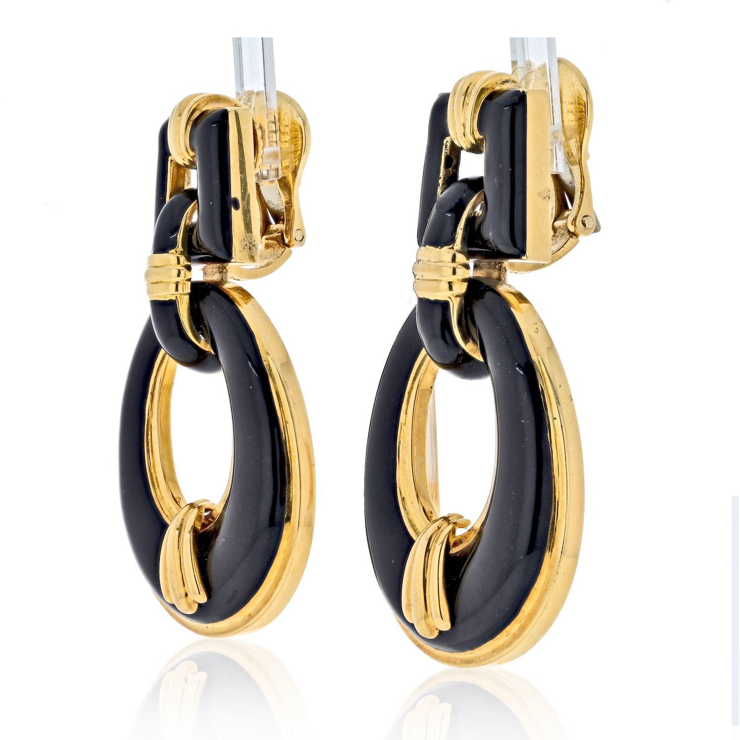 The earrings are designed in an articulated 'door knocker' motif, the open oval drops are suspended from a rectangular shaped element and suited with omega backs for fastening clips and the posts option for pierced ears can be easily added.
David