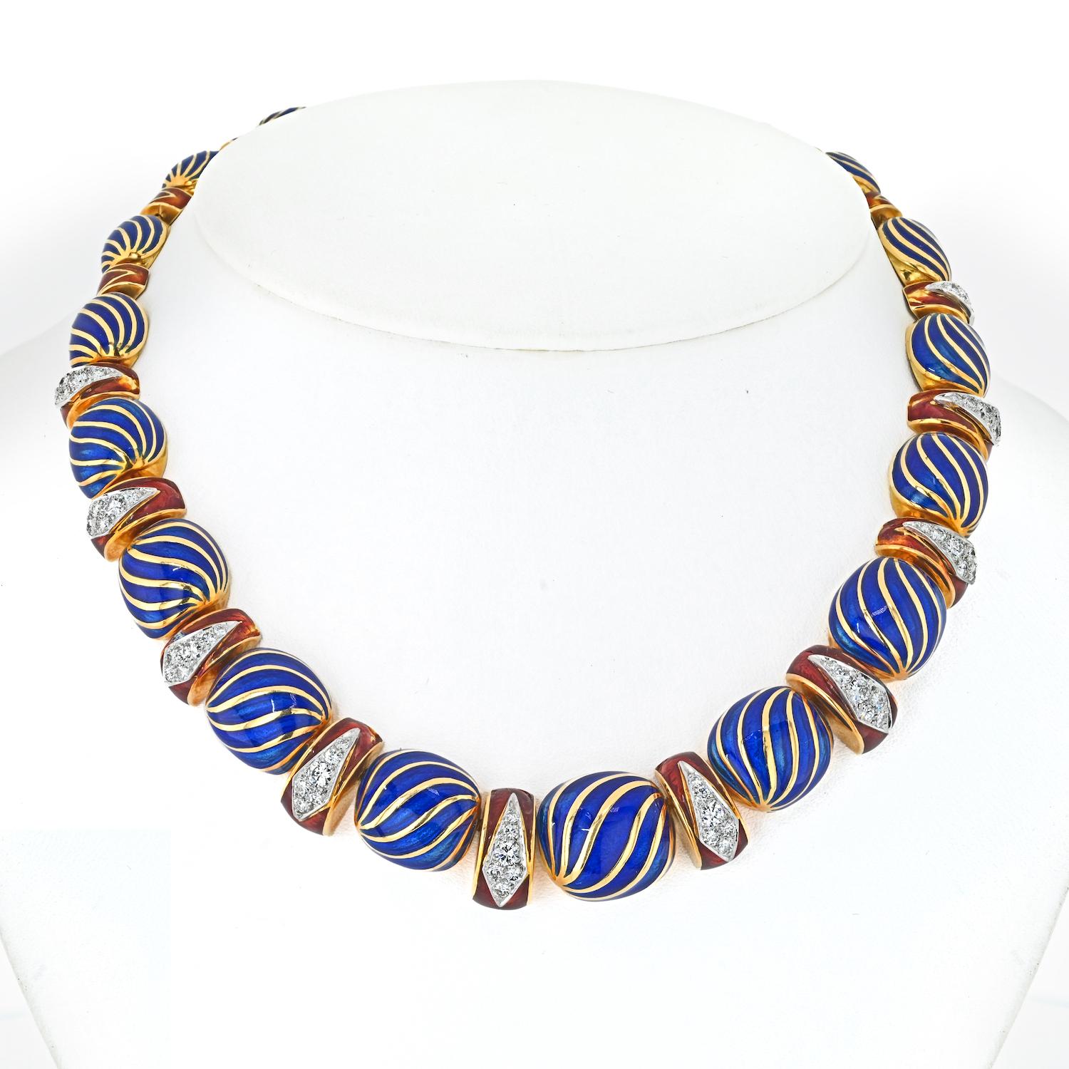 This David Webb 18K Yellow Gold Blue and Red Enamel Diamond Necklace is a true masterpiece of design and craftsmanship. Its exquisite beauty and attention to detail make it a remarkable addition to any jewelry collection.

With a length of 15