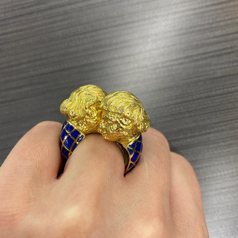 This solid ring looks quite aristocratic with two double heads facing each other like Gemini zodiac. Crafted in gold with flawless blue enamel and hand carved figures making this ring a heirloom-quality creation.

Material: 18K Gold with inside bar