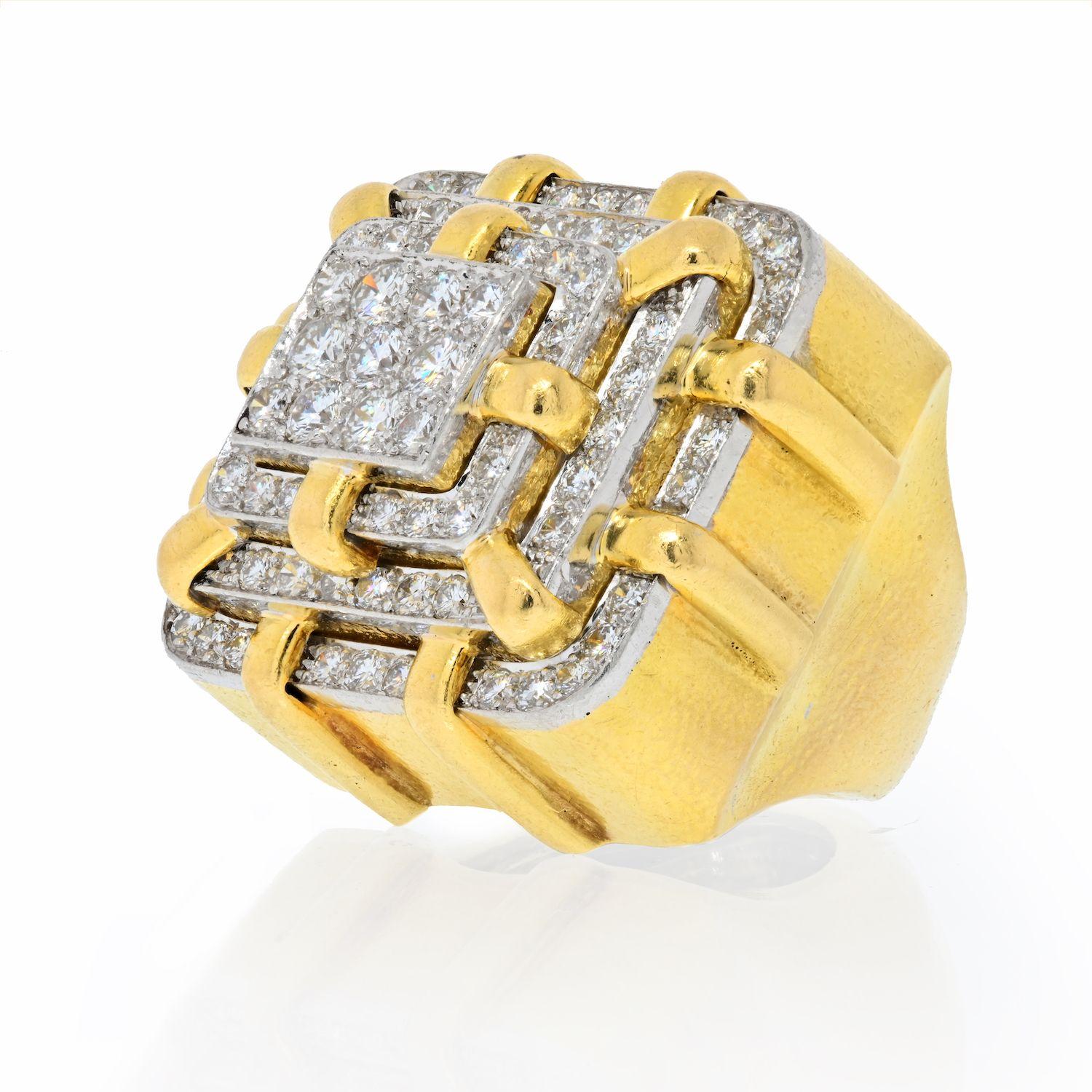 This is a very bold and heavy David Webb Platinum & 18K Yellow diamond ring. Fashioned as a bulky cube set with round cut diamonds atop in a pannel like style. Size 4. 45gr.