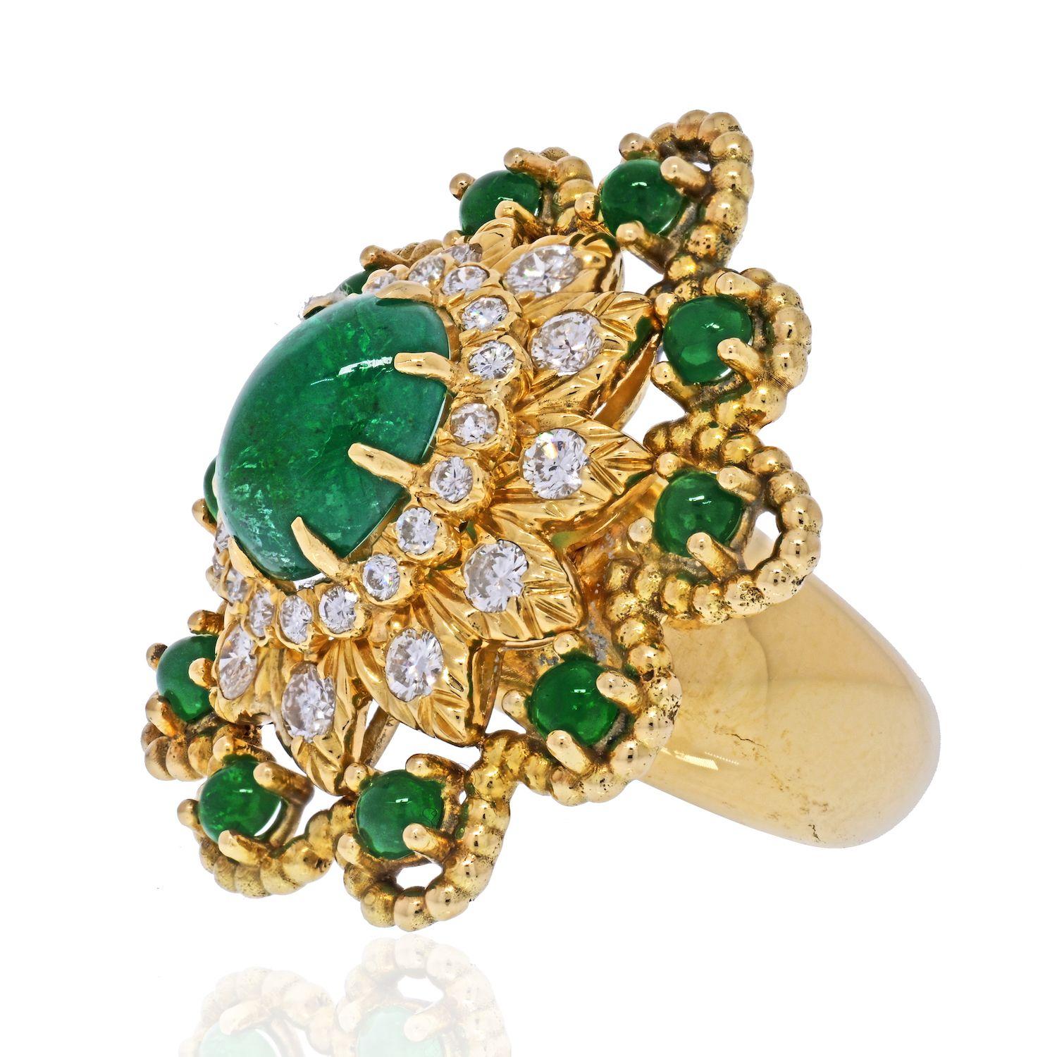 Exquisite David Webb 18K Yellow Gold Cabochon Emerald Diamond Flower Ring. 
Very rare vintage ring by David Webb that highlights an oval cut green cabochon emerald in the center center set in a halo of diamonds and surrounded by round cut cabochon