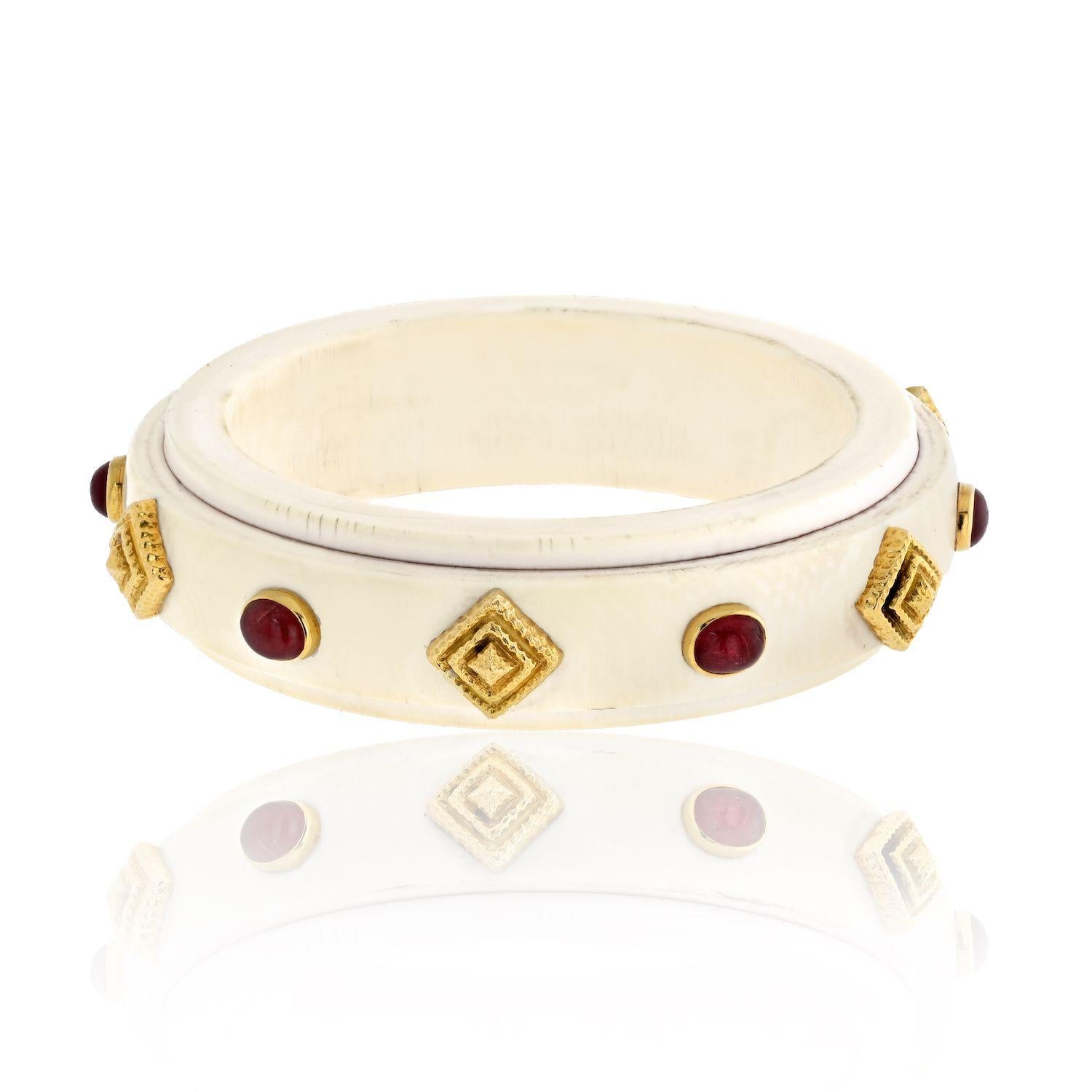 Step into the realm of timeless elegance with a vintage David Webb Slip-On Bangle, a true testament to the brand's legacy of luxurious craftsmanship. Crafted in exquisite 18kt gold, this bracelet marries opulence and sophistication in a single