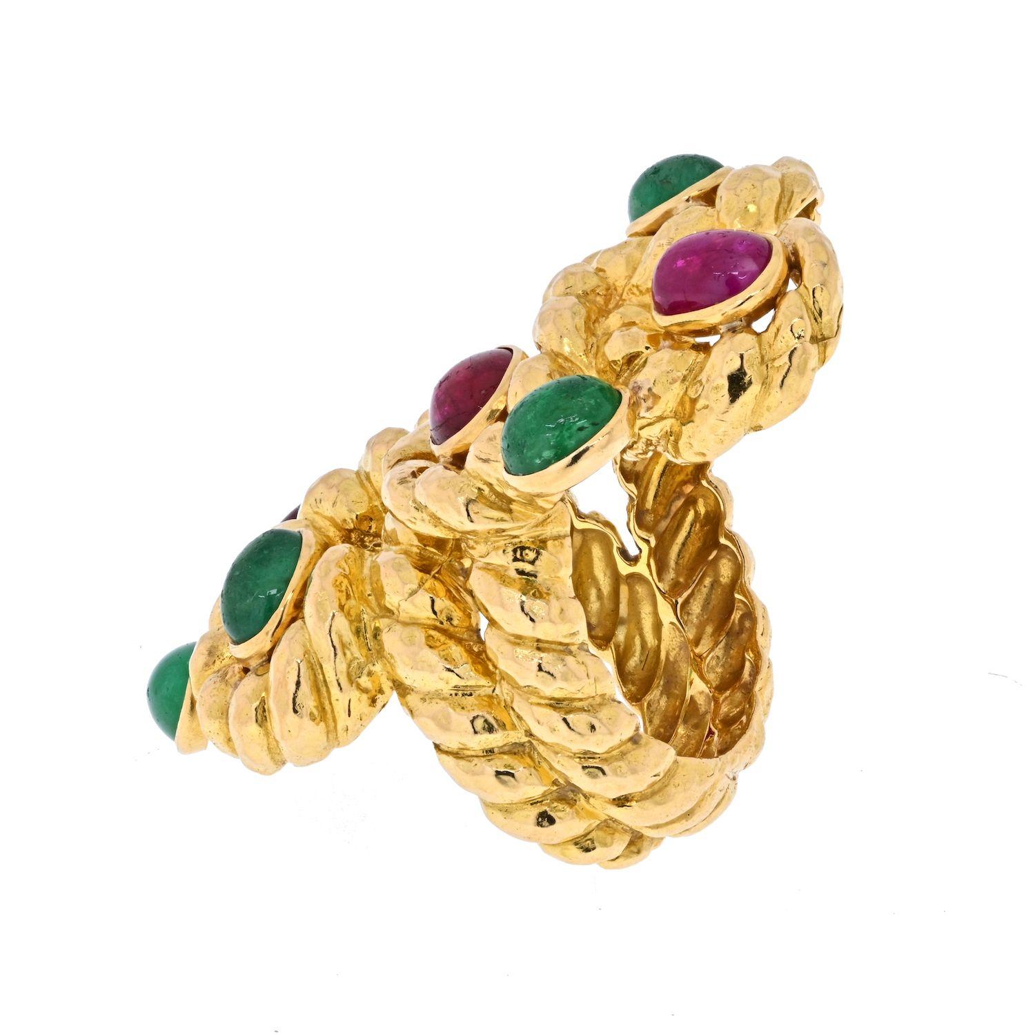 This is a beautiful David Webb Yellow Gold Cabochon Ruby, Green Emerald Serpent Ring made in 18k yellow gold. 
Impressive finger coverage perfect for someone who has a larger finger size and likes a bold looking jewelry. 
Finger size: 8.5 
Ring