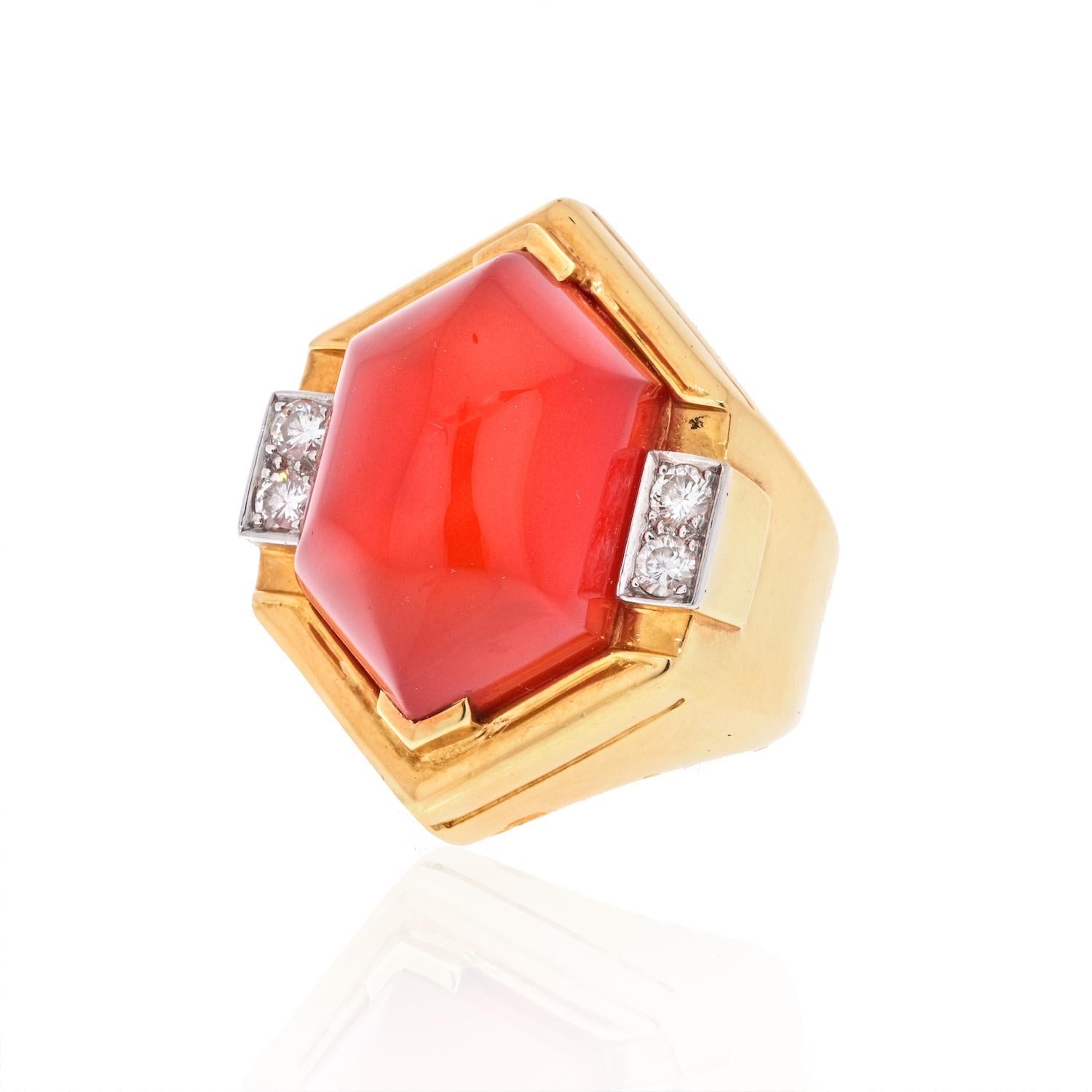 David Webb Platinum & 18K Yellow Gold Carnelian Shield Frame Diamond Ring.
18K yellow gold, stamped: Webb
Centering a hexagonal carnelian cabochon flanked by four full-cut diamonds totaling approximately 0.30 ct. and graded G-H color, VS