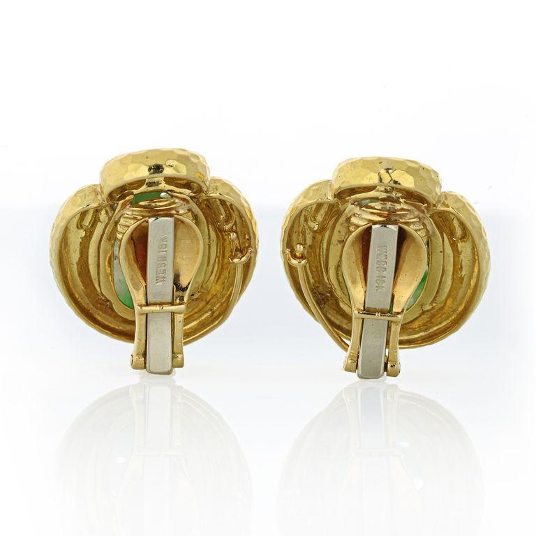 Spiritual and earthy this pair of yellow gold earrings is set with carved jade of 17mm x 11mm in size.
Clip on closure. 
L: 1.1 inches W: 0.8in
