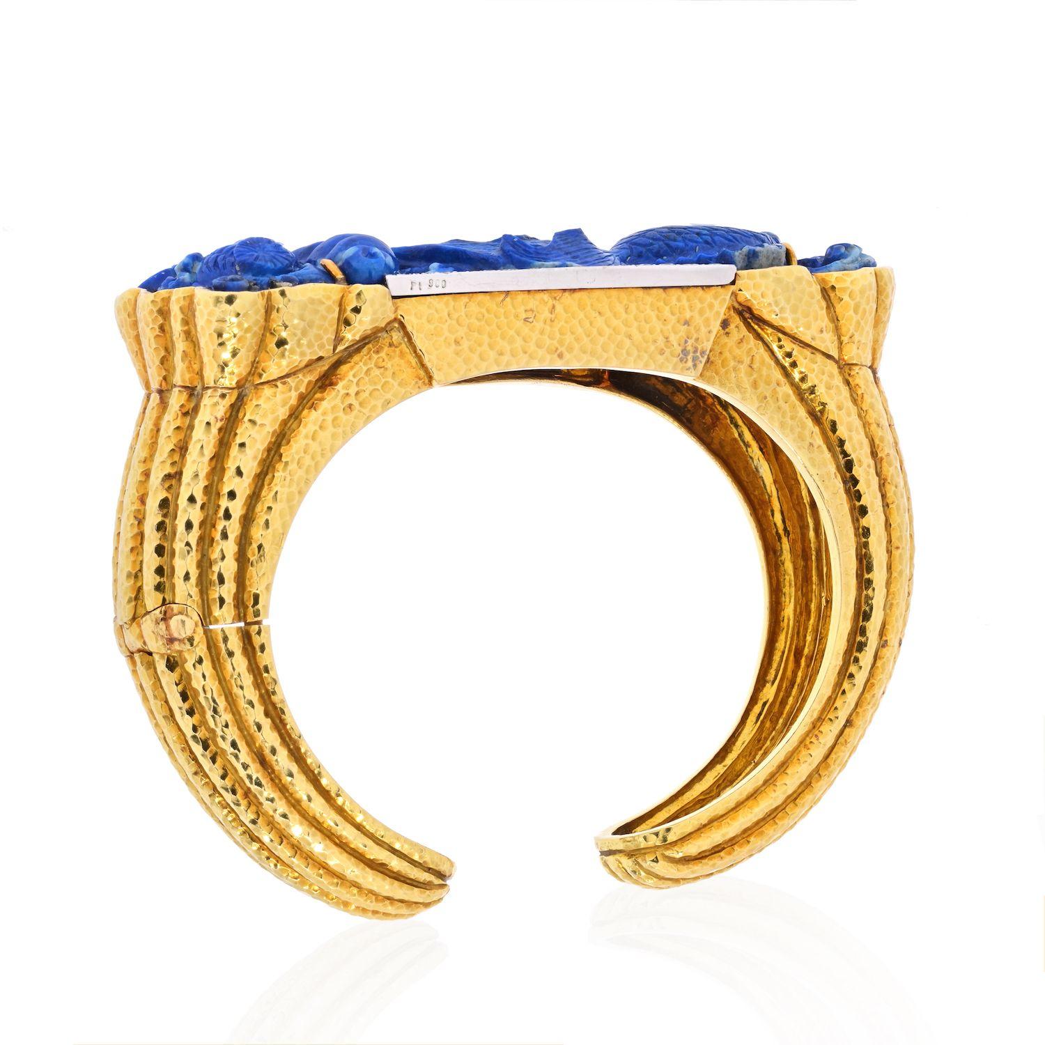 Elegant, stylish and colorful bracelet created by David Webb in the 1980s. Made of carved lapis lazuli, 18 karat yellow gold and accented with round brilliant cut diamonds (F-G color, VS clarity, total weight approximately 0.55 carat). 

The