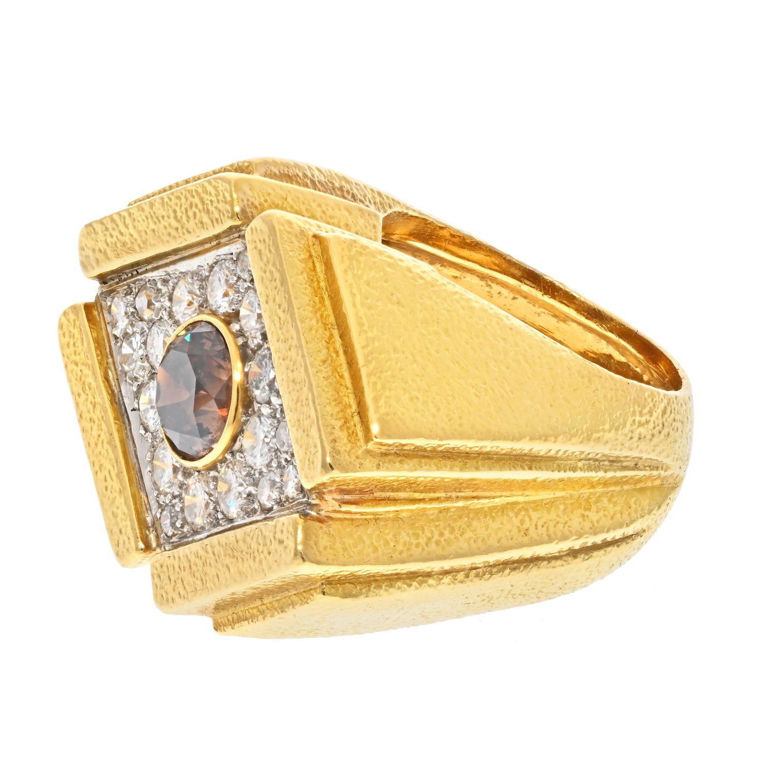 This is a modern looking oversized champagne diamond ring by David Webb. It is made in 18K solid gold as all of his rings, diamonds are mounted in platinum. This ring has a signature finish to the gold surface and sits tall off the finger. 
Center