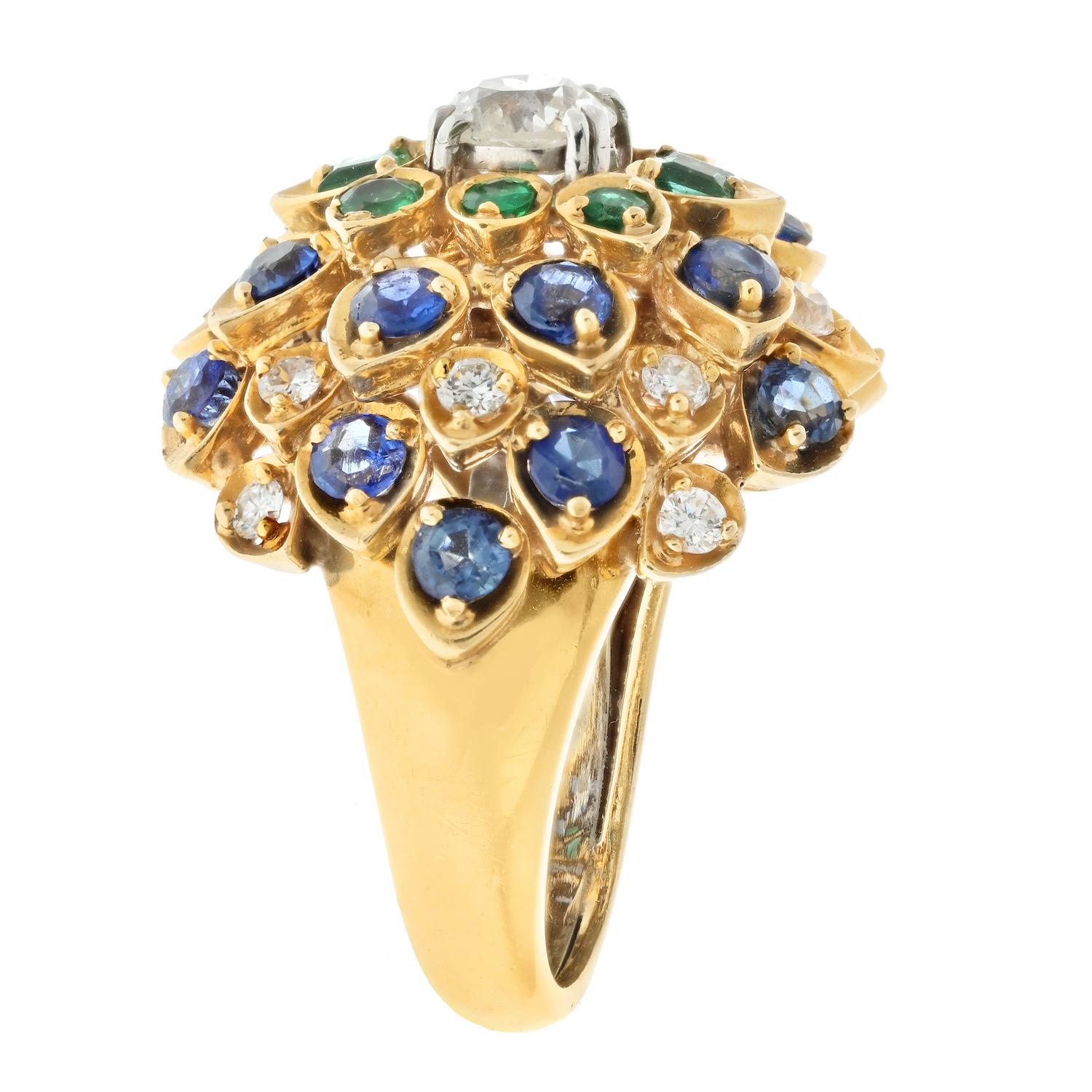 This David Webb Cluster Ring is a stunning example of the designer's impeccable style and craftsmanship. Crafted in 18K yellow gold and dating back to the 1950s, this ring features a center stone that is an old mine diamond. Surrounding the diamond