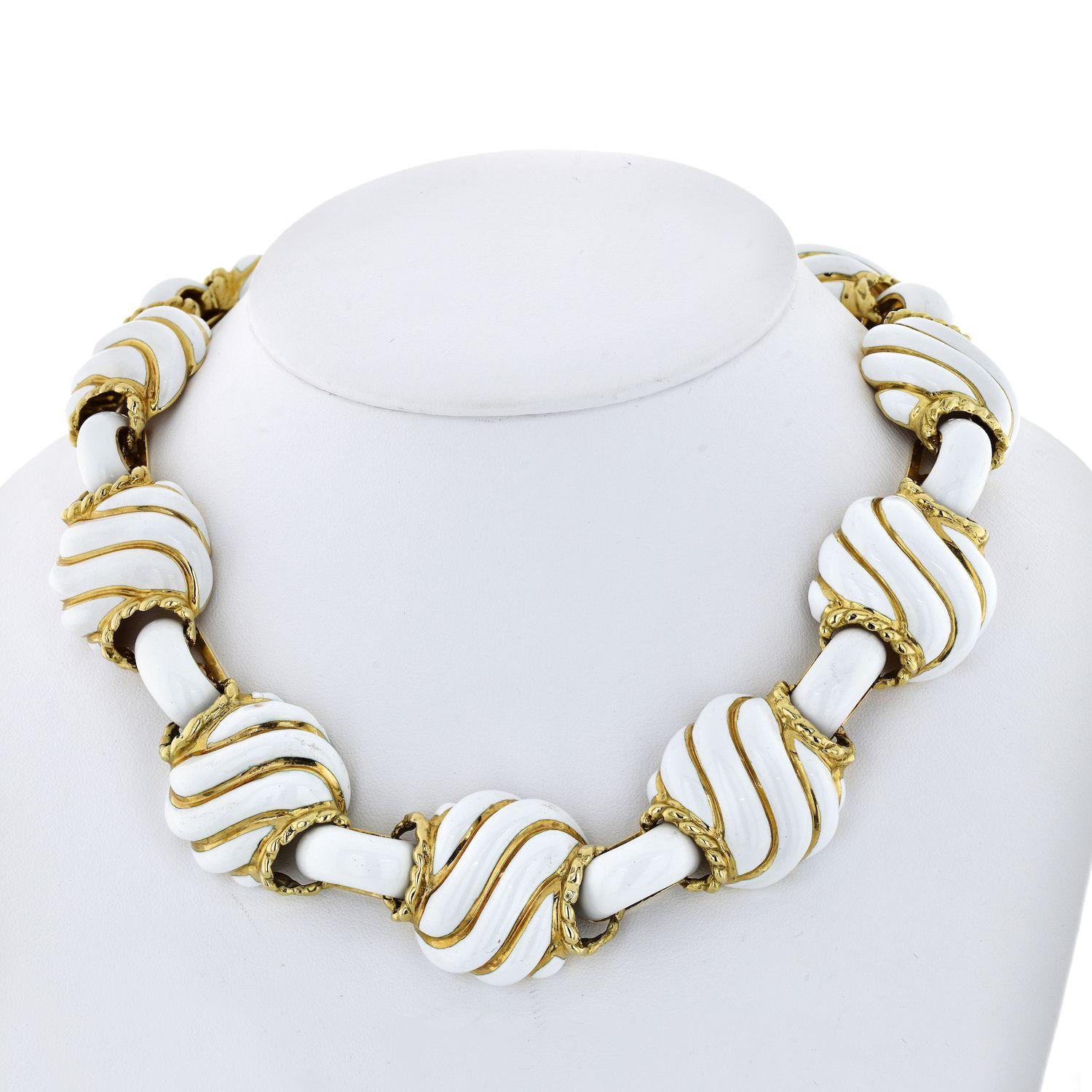Beautiful and bold this 18K Yellow Gold David Webb Collapsible White Enamel Choker will become your favorite necklace. 
This necklace collapses into two bracelets. Wear it as you please, everyone will think you are a savvy David Webb collector.