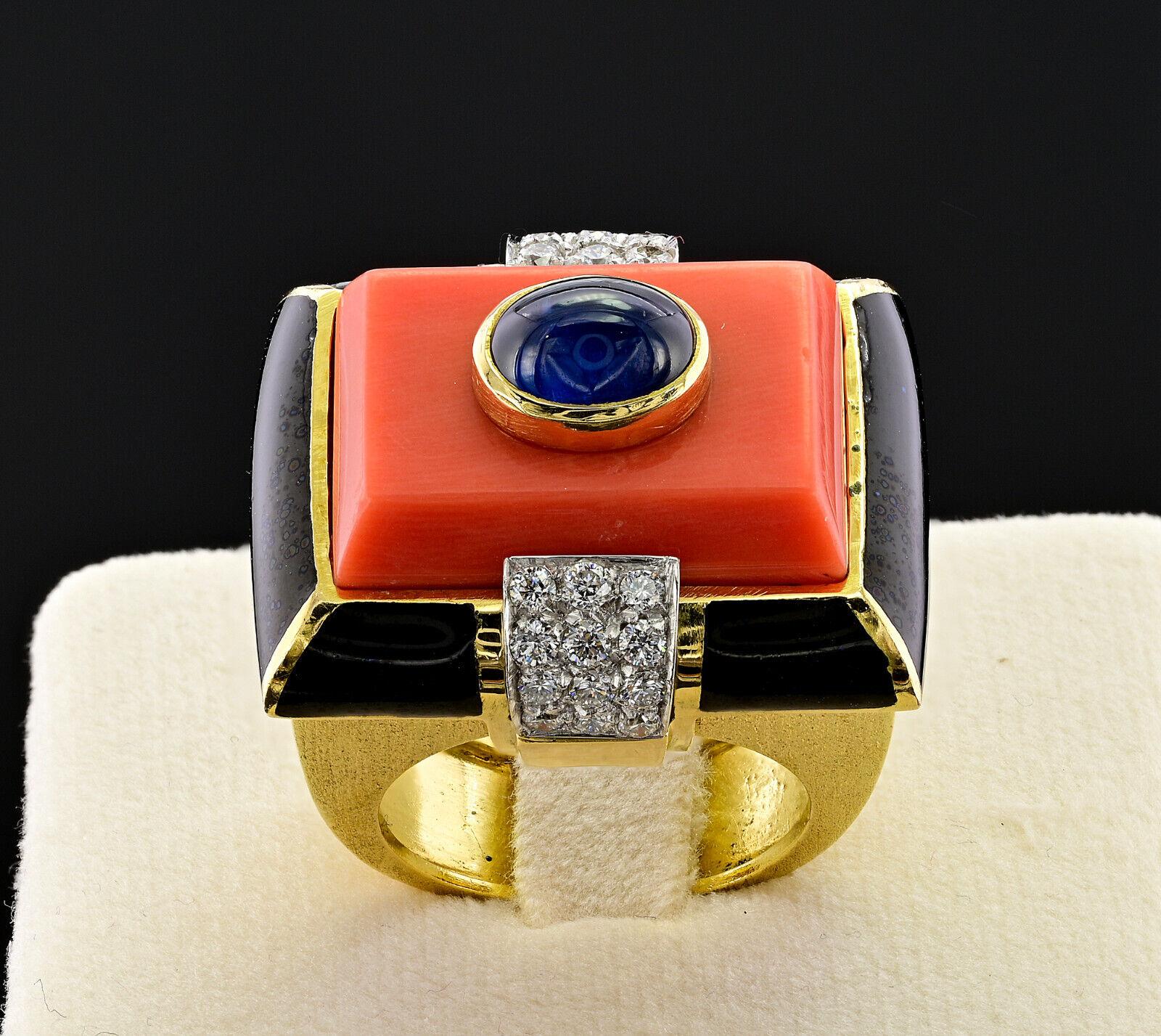 David Webb 18k Yellow Gold, Diamond, Enamel, Coral & Cabochon Sapphire Cocktail Ring Circa 1970s Vintage

Here is your chance to purchase a beautiful and highly collectible designer cocktail ring.  

A breathtaking David Webb vintage ring, 1960