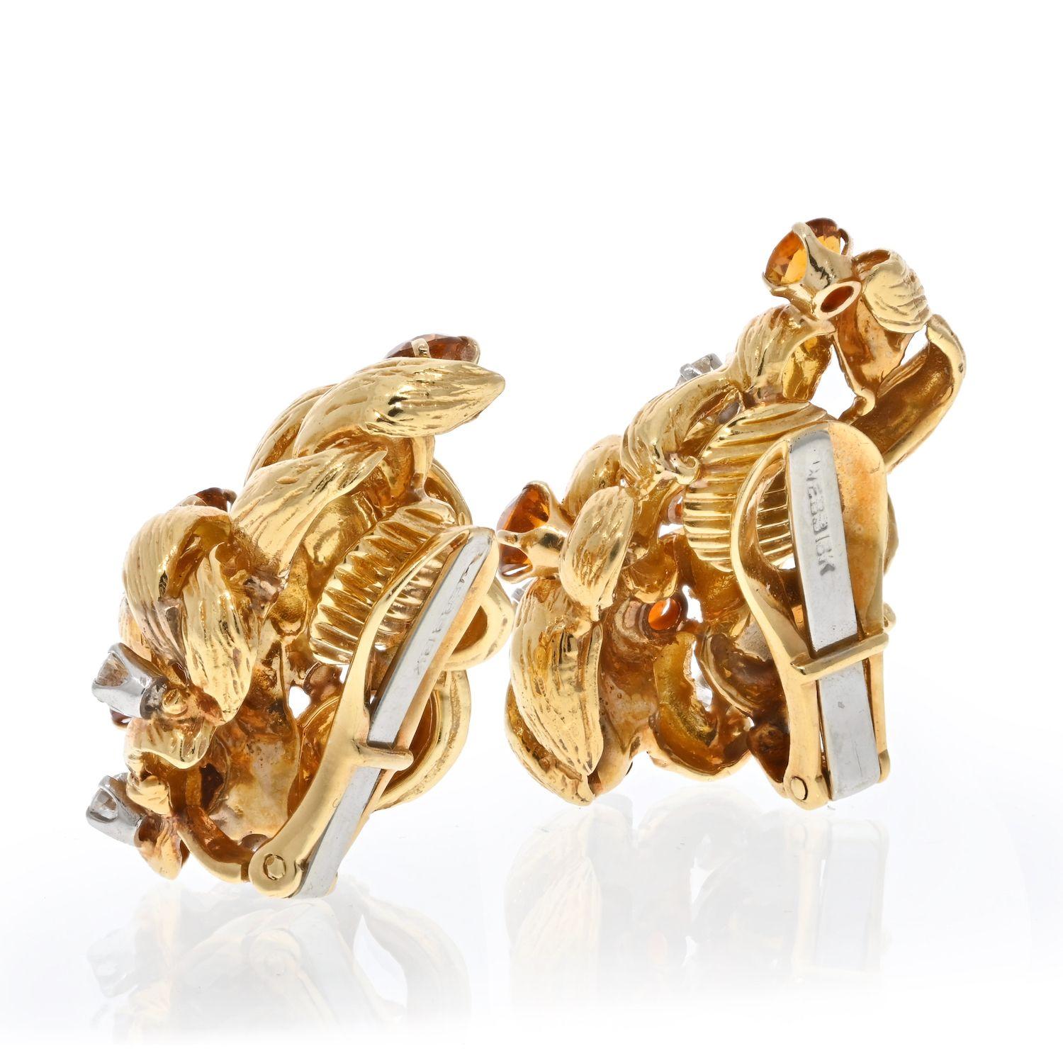 Lovely estate earrings by David Webb with diamonds and citrines come to us from the older collections. Signature finish over the gold. Diamonds and citrines are in great condition. The earrings are just under 1 inch long. 
Clip on closure. 