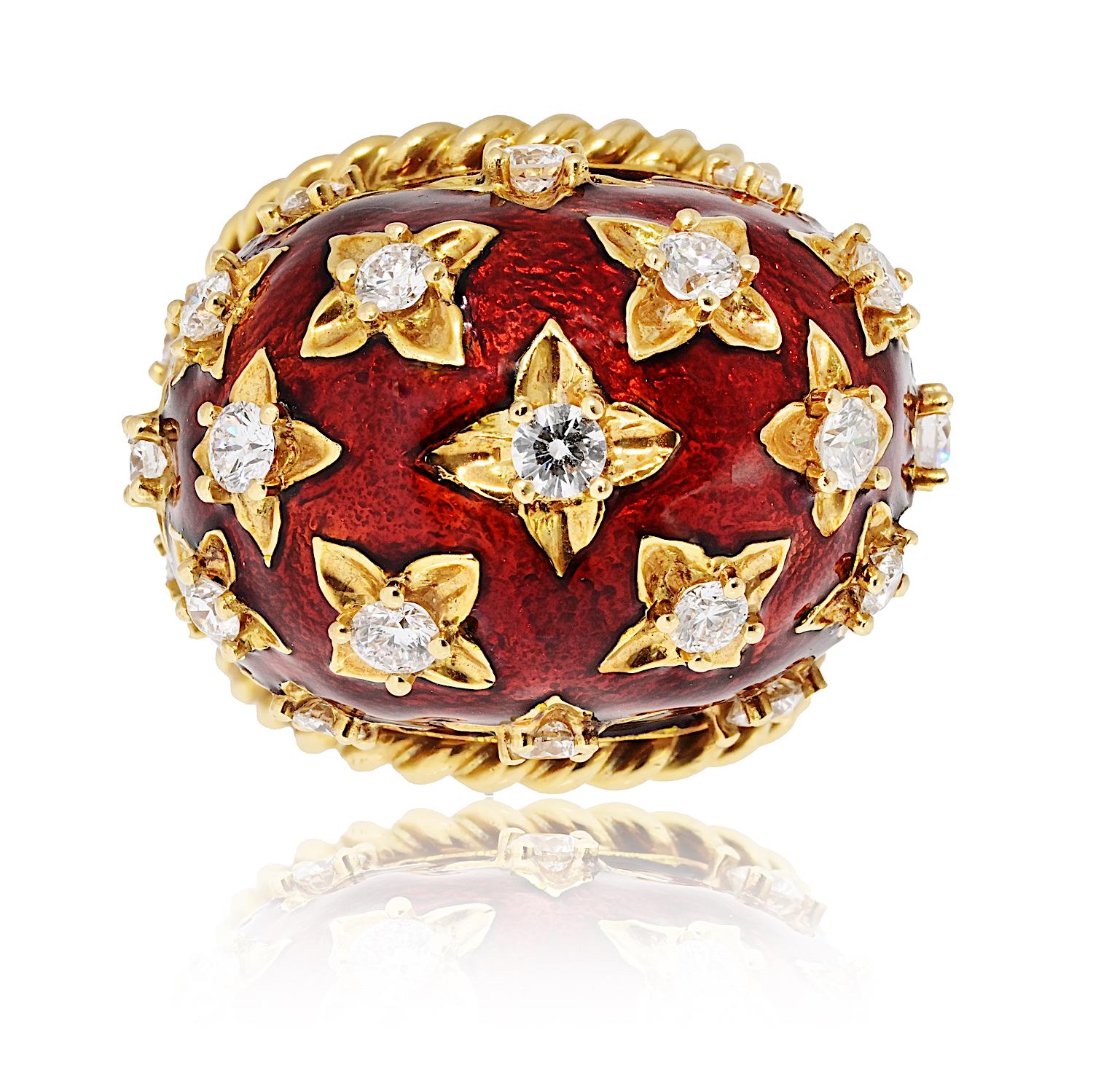 This striking David Webb dome ring is crafted from platinum and 18K yellow gold, featuring a bold red enamel surface adorned with meticulously placed gold stars. Brilliant diamonds are set within the design, adding a touch of sparkle and elegance. A