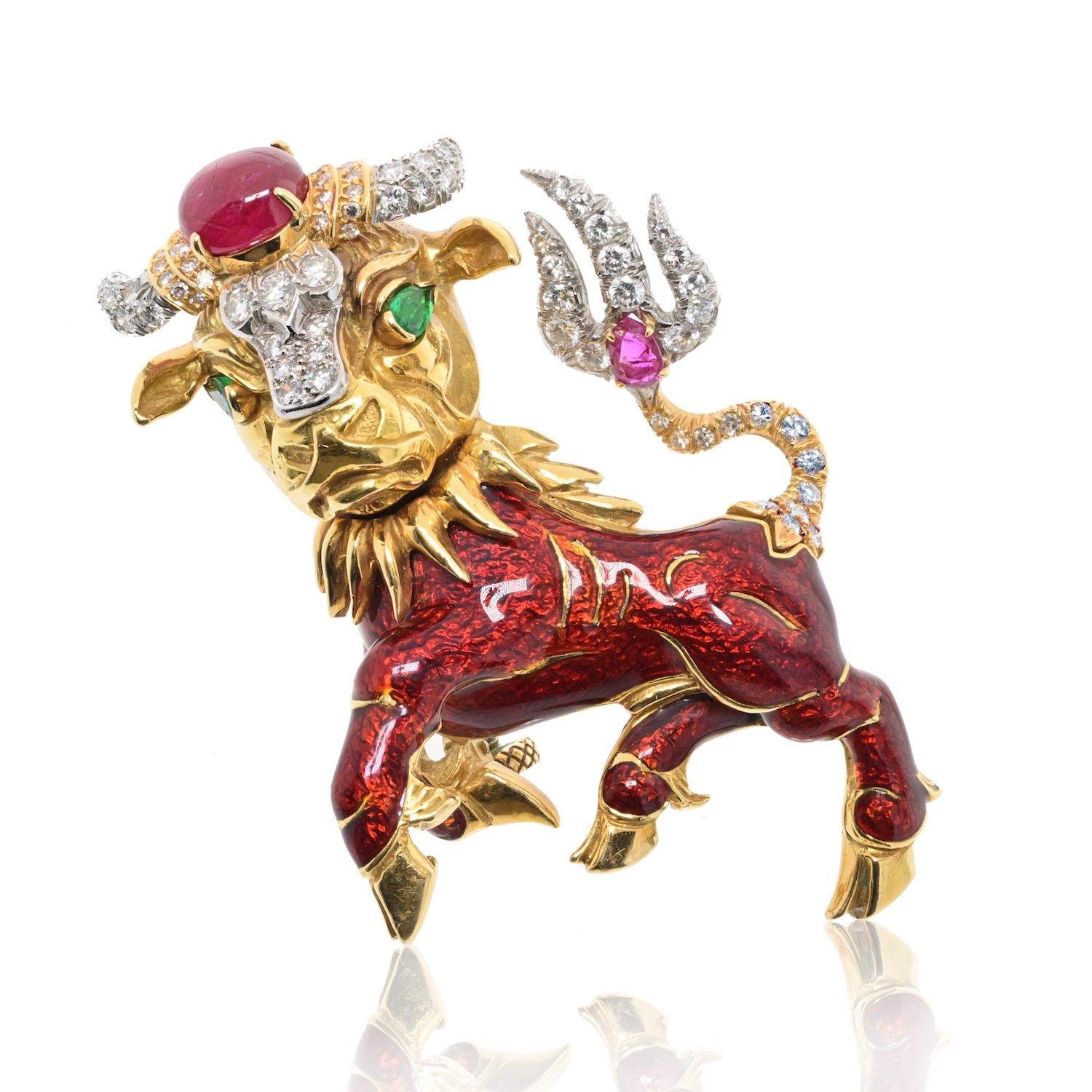 Step into the world of exquisite craftsmanship with the David Webb Pin, a captivating piece adorned with enamel, rubies, emeralds, and diamonds. 

Of taurus design, applied with red enamel and set with brilliant-cut diamonds, a ruby cabochon and