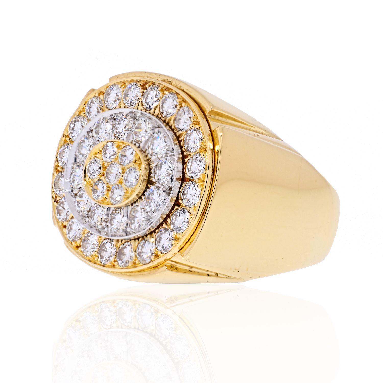 Chunky statement ring is designed as an oval mounting with stepped tiers of gold alternating with platinum. Pavé and bead set throughout by round brilliant cut diamonds weighing approximately 4.50 carats total; G/H color with VS clarity. 
Size 7.5
