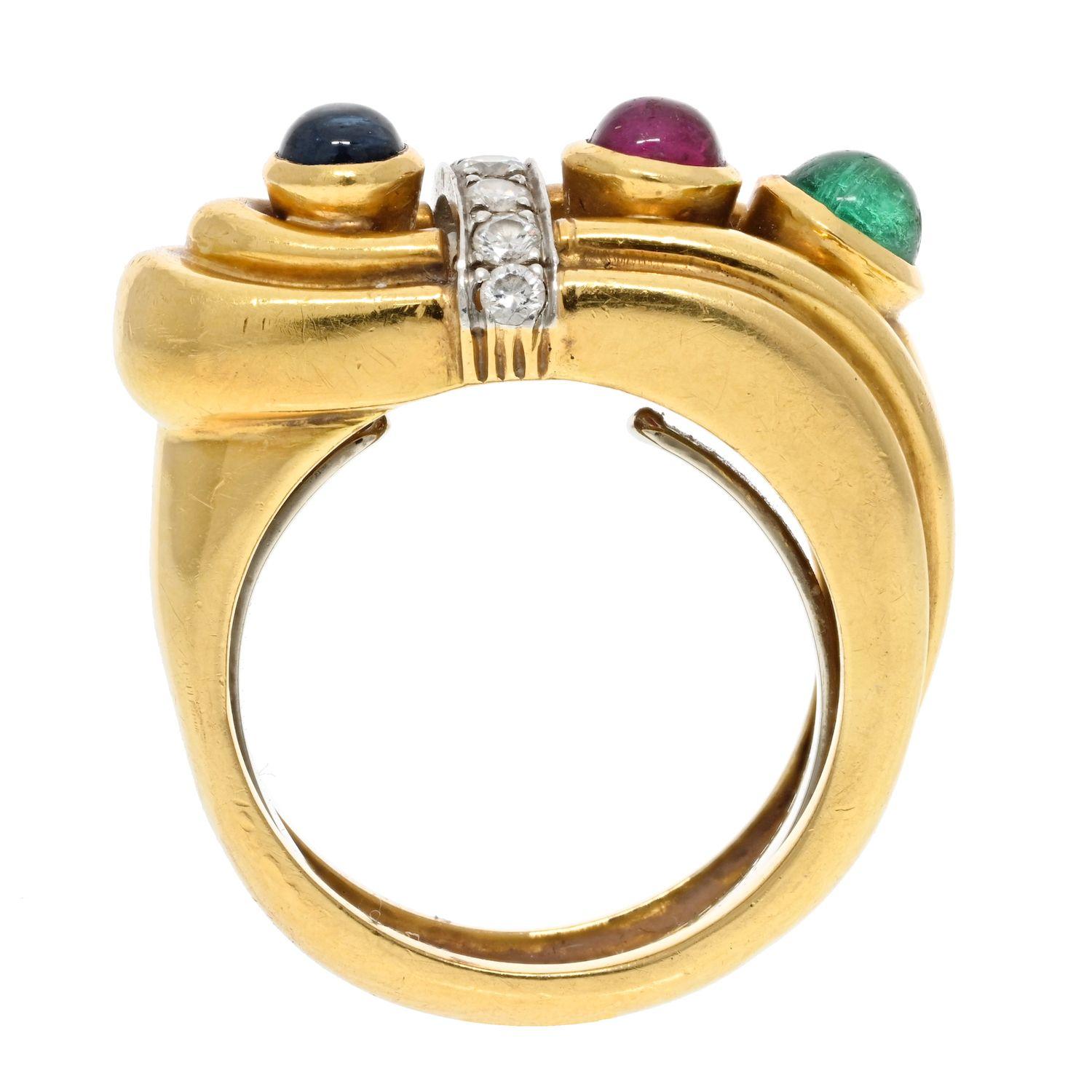 David Webb 18K Yellow Gold Diamond, Sapphire, Ruby And Emerald Buckle Ring.
18K yellow gold David Webb cocktail ring featuring bezel set ruby, sapphire and emerald with prong set round brilliant diamond accents throughout.
Measurements: Band Width