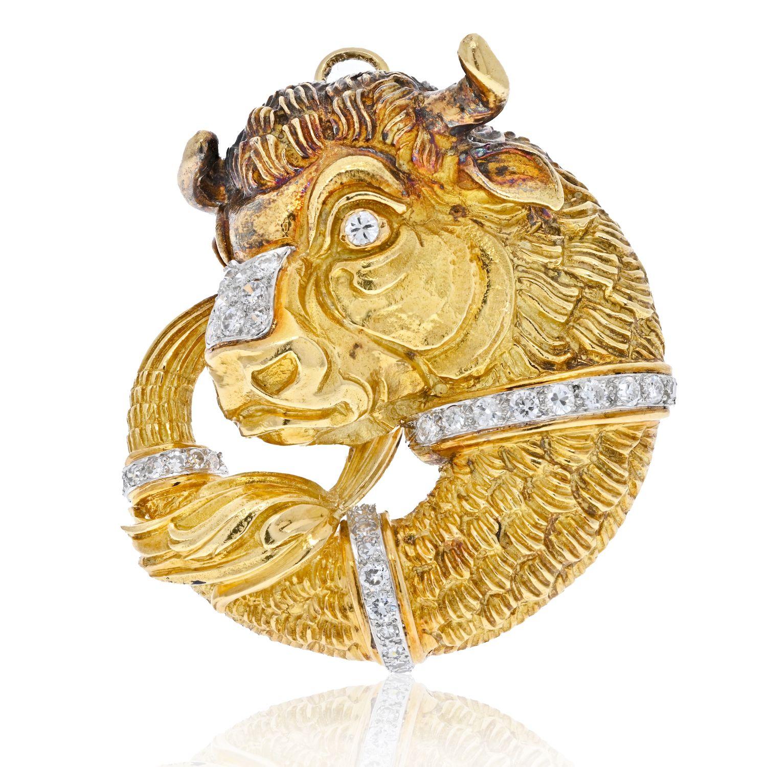 Bold and colorful pin/pendant created by David Webb in the 1970's. David Webb got a lot of inspiration in the Animals World and this Taurus pin is a great example of it.
Made of 18 karat yellow gold, the bison's eyes are accented with diamonds and