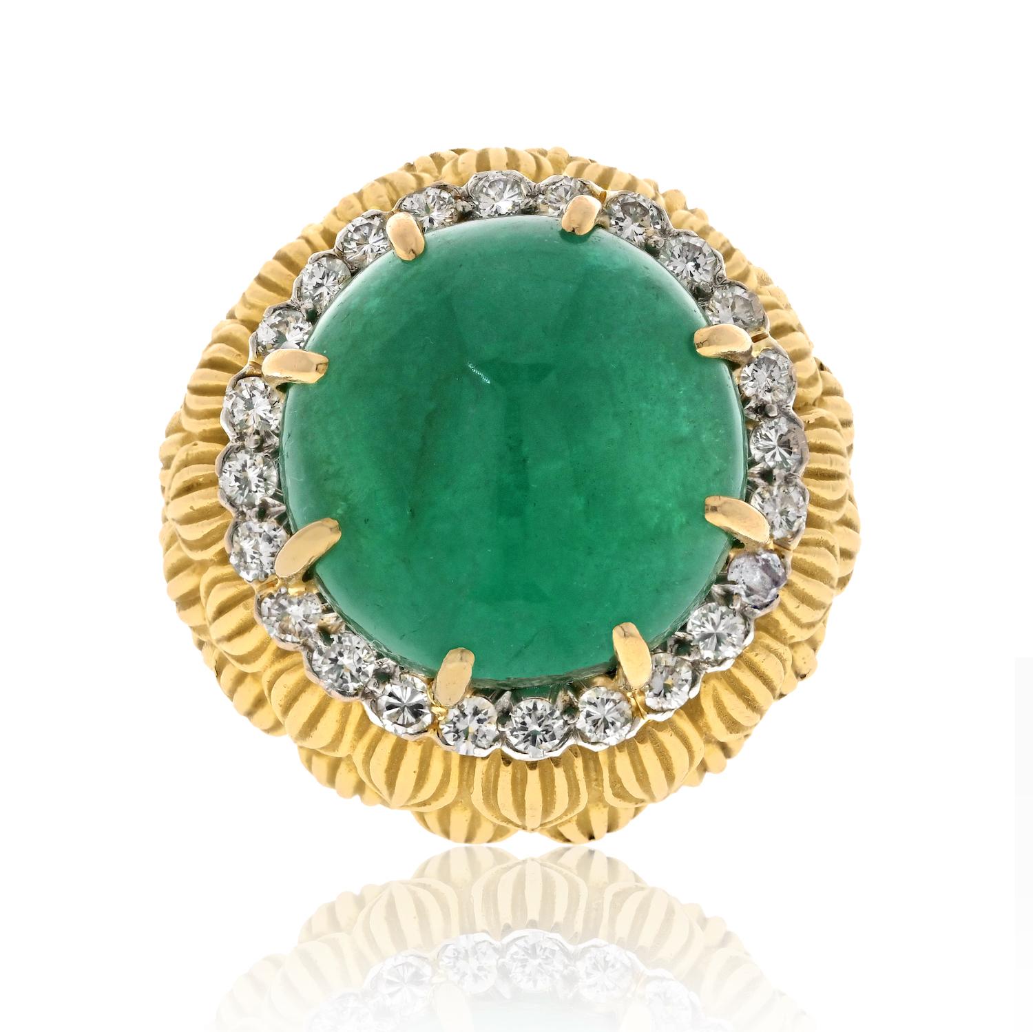 Elevate your jewelry collection with our David Webb Platinum & 18K Yellow Gold Cabochon Green Emerald And Diamond Textured Ring. 

This exceptional piece features a magnificent 24-carat cabochon green emerald at its center, radiating with vibrant
