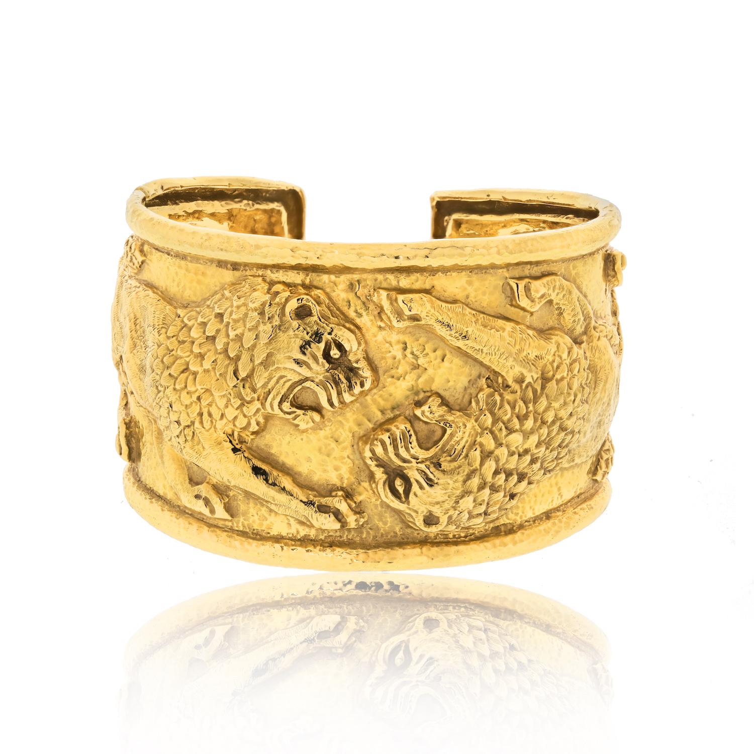 Prepare to be captivated by the timeless allure of this vintage David Webb cuff bracelet, exquisitely designed with two majestic lions facing each other. This bracelet showcases the unparalleled artistry and craftsmanship for which David Webb is