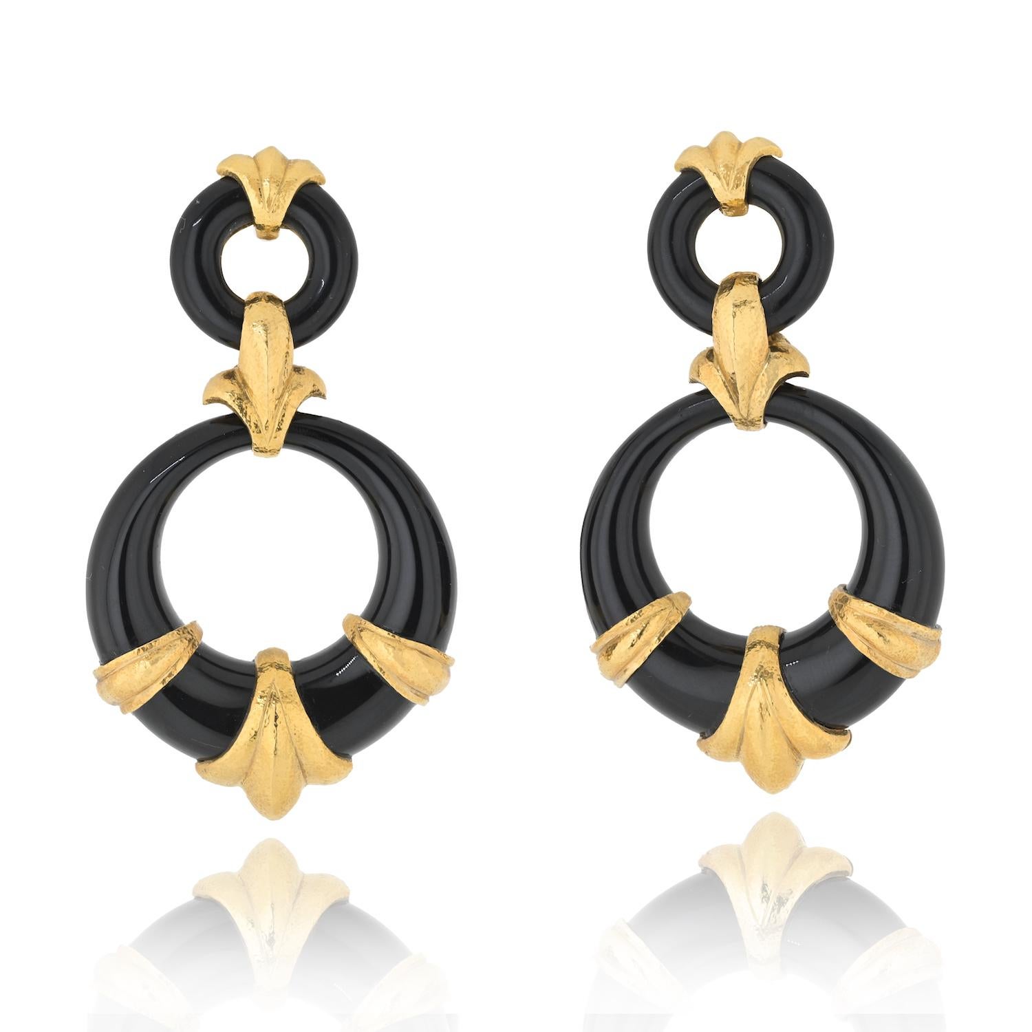 Introducing a stunning pair of estate Fleur-de-Lis Hoop Earrings from David Webb's Ancient World collection. These captivating earrings are a perfect blend of vintage elegance and contemporary flair.

Measuring 2.25 inches in length, these hoop