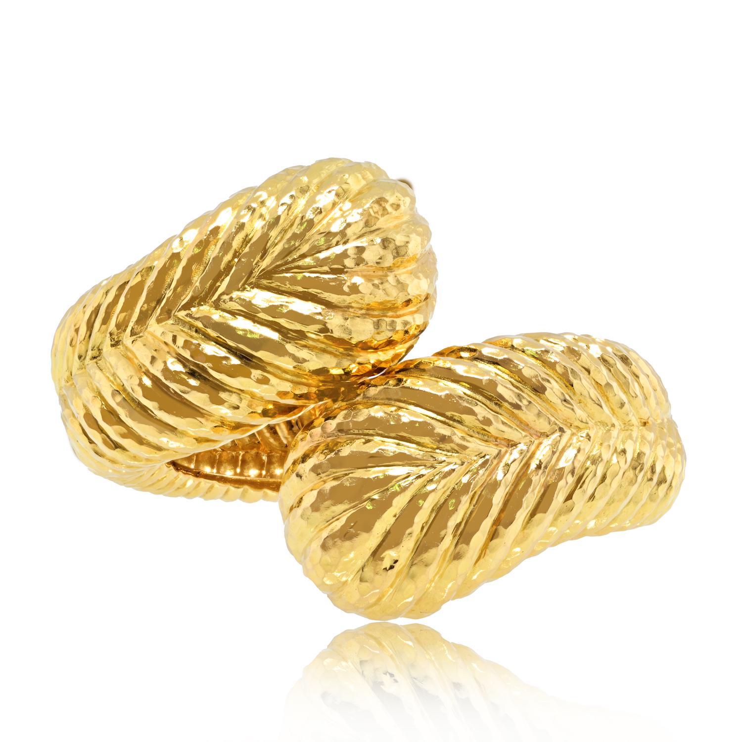 Immerse yourself in the distinctive style of David Webb with this Late-20th Century 18K Gold Bracelet. Known for his bold and innovative designs, this hinged bracelet showcases Webb's mastery in creating jewelry that is both striking and