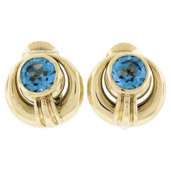 David Webb 18k Yellow Gold Gia Lab Grown Round Blue Spinel Omega Earrings