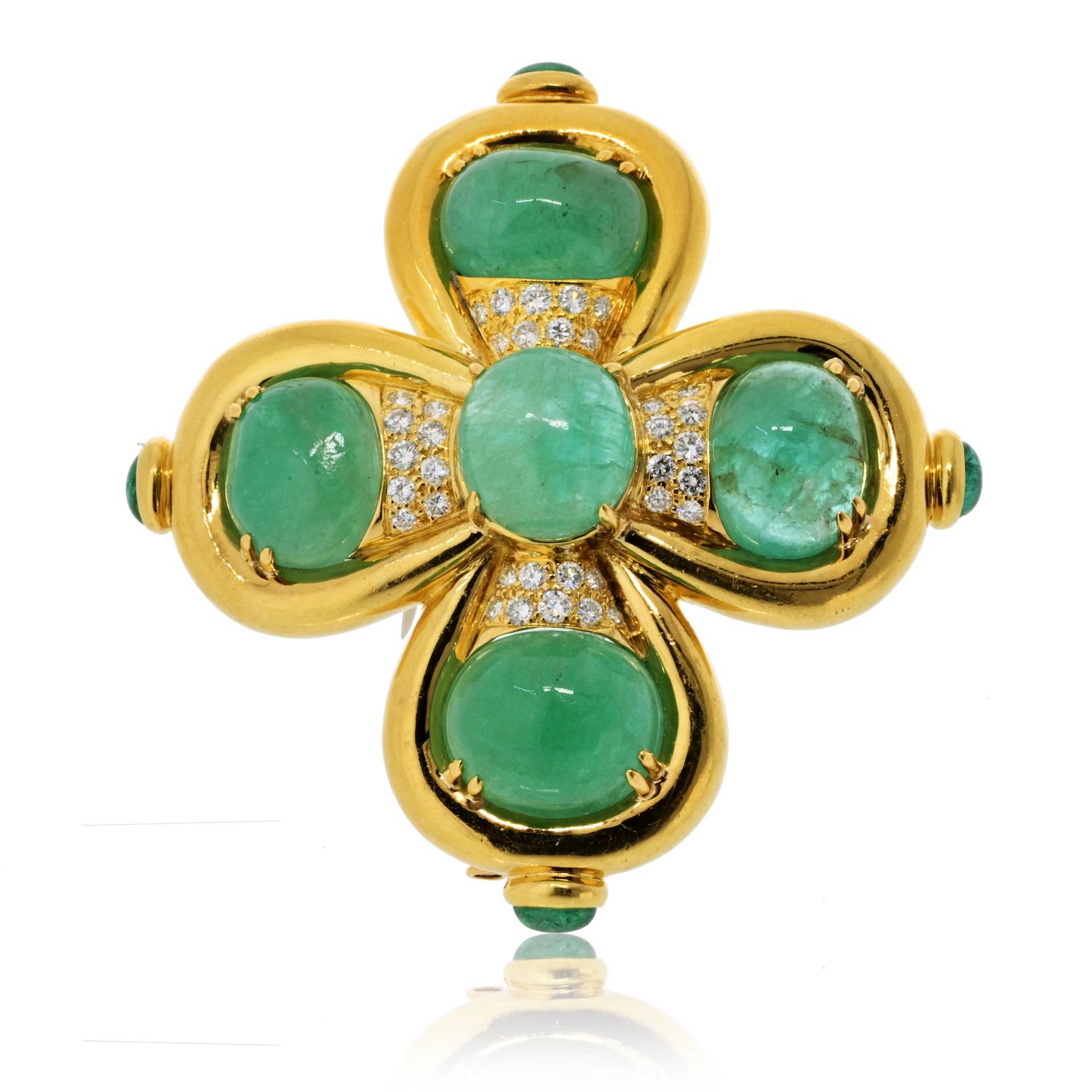 A striking embodiment of regal elegance, this **David Webb heraldic-inspired brooch** is a true collector’s treasure. Expertly crafted in **18K yellow gold and platinum**, the design showcases rich **cabochon-cut emeralds**, their lush green hue
