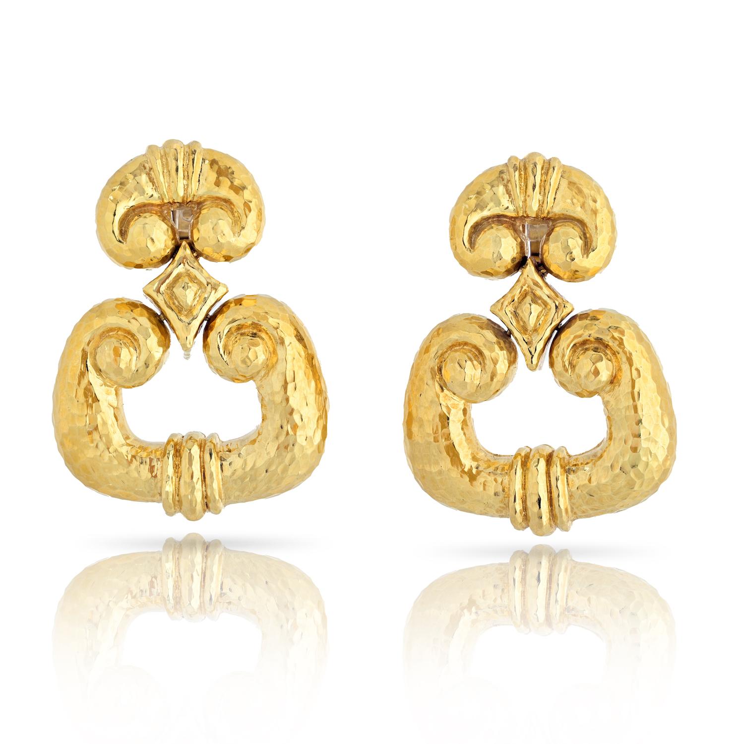 Elevate your style with these exquisite David Webb Platinum & 18K Yellow Gold Hammered Door Knockers Earrings. Measuring at a perfect length of 1¾ inches, these earrings offer a harmonious blend of modern luxury and timeless elegance. The