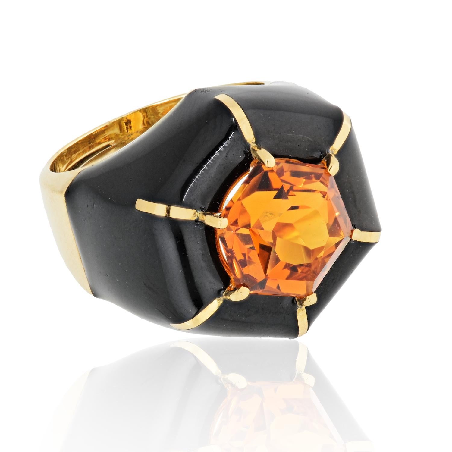 A David Webb ring in 18K yellow gold featuring an octagon-cut citrine and black enamel. 
Finger Size 6.5