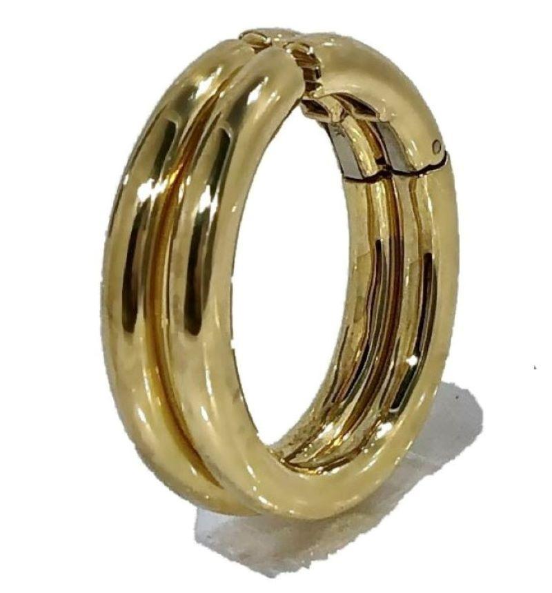 This lovely and very well constructed pair of David Webb Hoop earrings are crafted from 18k yellow gold. They are quite large with a length of 1 3/8 inches, a width of 1 1/8 inches, and a diameter of more than 1/8 inch in the tubing used to create