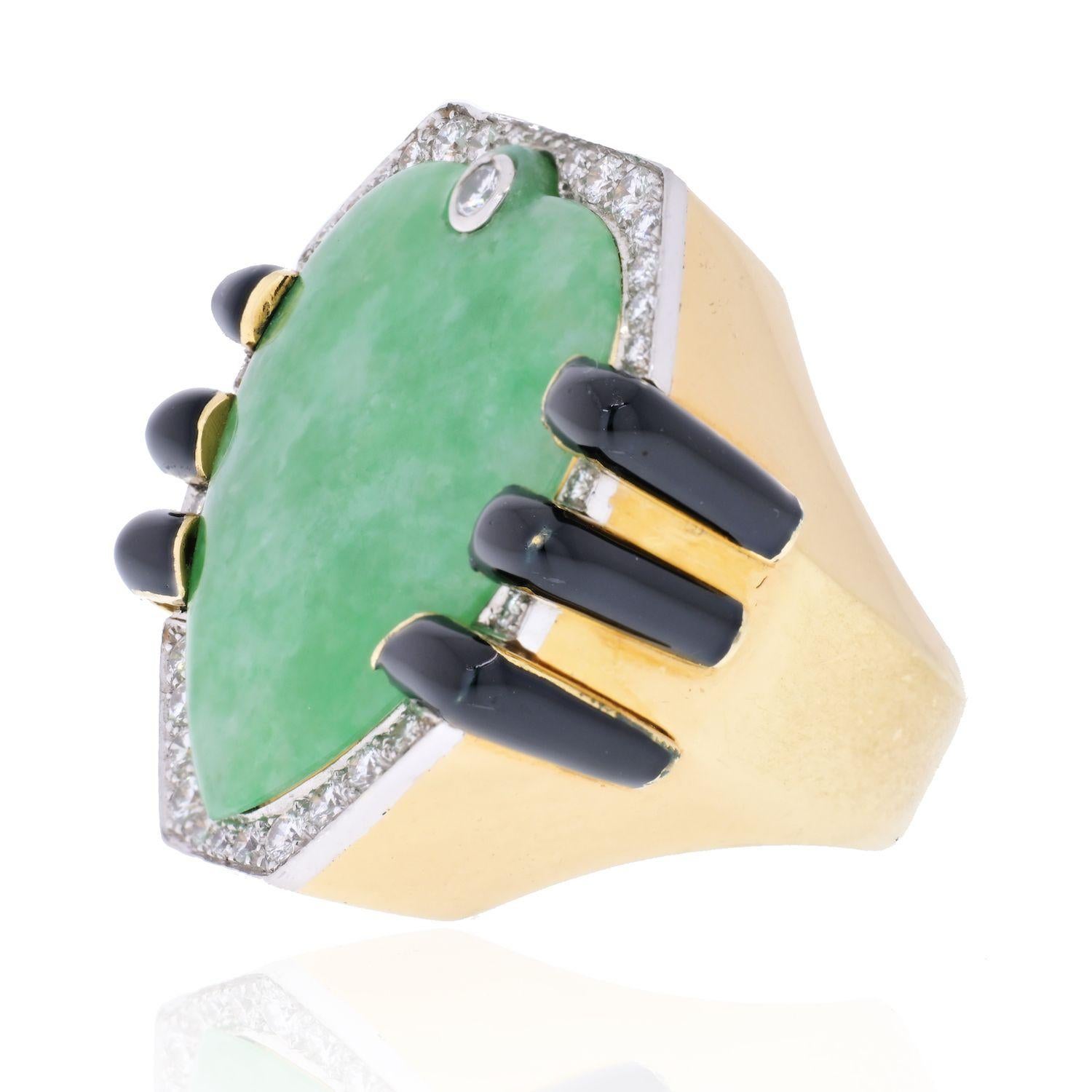 This is a very unusual ring made by David Webb, crafted in gold mounted with a large natural jade, diamonds and accented by black enamel.
Wear this strikingly sculptural ring, with its geometrical cut jade, in Webb#s spirit of passion for the past,