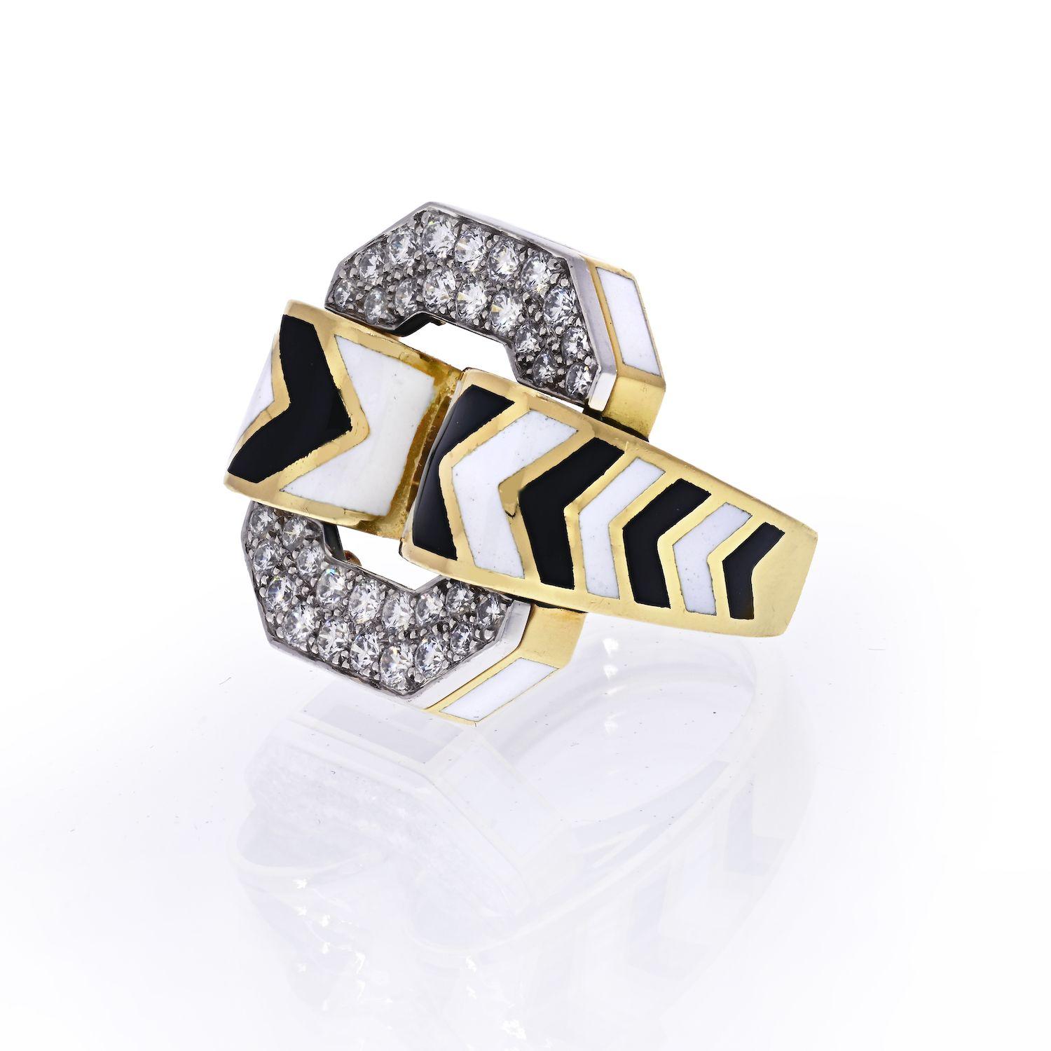 David Webb's large chevron ring features black and white enamel, platinum, and brillant-cut diamonds set in 18k yellow gold. 
The ring measures 23mm in width and is size 6.5.
