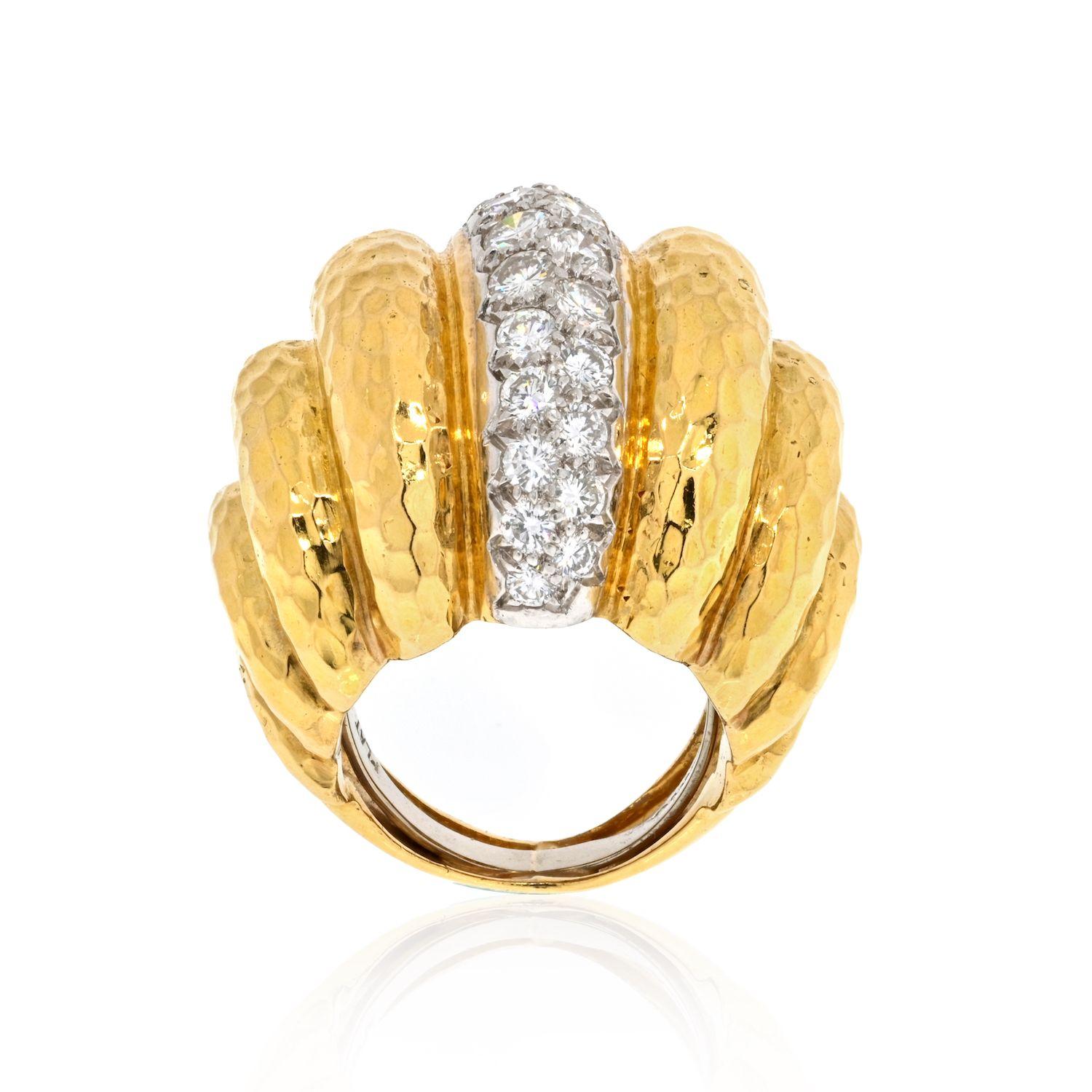 This is a fluted cocktail ring by David Webb in hammered 18k yellow gold, signed 