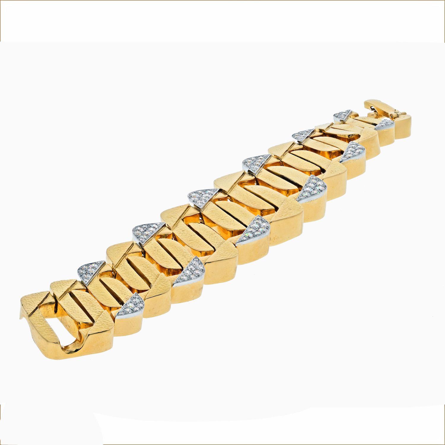 Curb-link bracelet in high-polished hammered finish 18k yellow gold, accented by round brilliant-cut diamonds set in platinum on the edges. 
TYPE: VINTAGE BRACELETS
EXACT DIAMOND WEIGHT: 12.00 CTS
Length: 7.5 inches approx. 
Thickness: 0.25