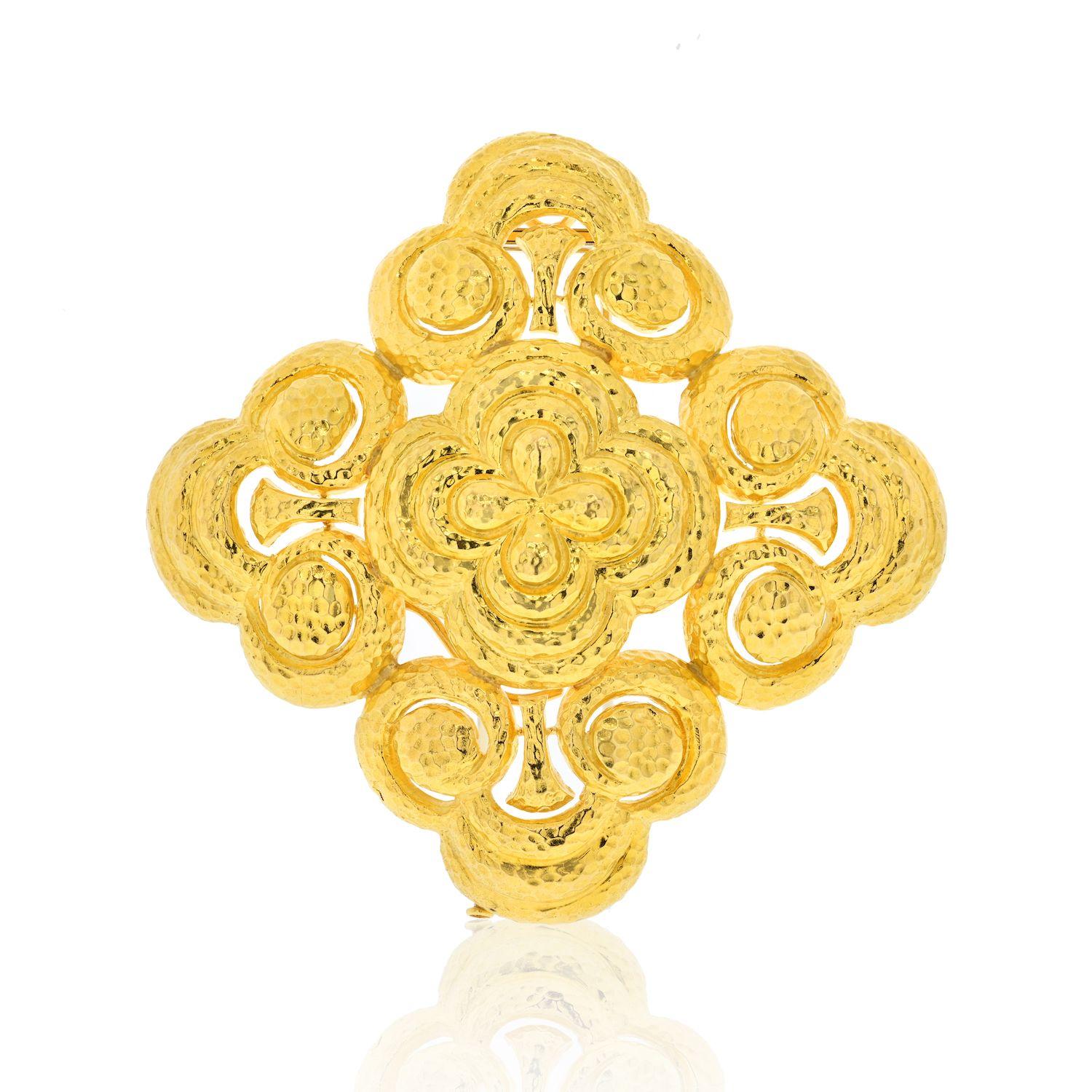 This is a classic David Webb 18K Yellow Gold Heraldic Hammered Finish Pendant Brooch. Perfect to place on your oversized sweater or attach to a David Webb chunky chain. This brooch is a perfect pendant too. 
Width: 3.5 inches.