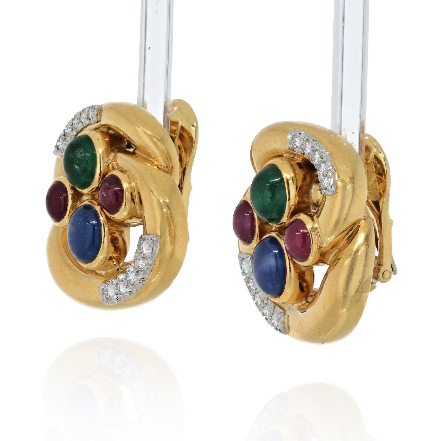 Bright and exciting thispair of clip earrings is designed by David Webb. Mounted with multi gems like sapphires, rubies, emeralds along with round cut diamonds these earrings are a lovely pair to wear day to night. 
Width accorss 25mm.