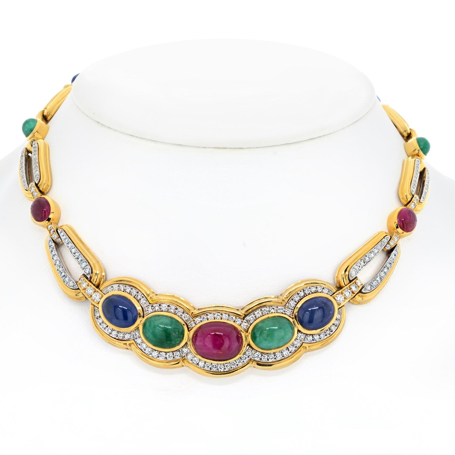 The estate David Webb Platinum & 18K Yellow Gold Cabochon Cut Sapphire, Ruby, and Emerald Necklace is an extraordinary piece that encapsulates the designer's flair for merging timeless elegance with opulent craftsmanship. 

The necklace is adorned