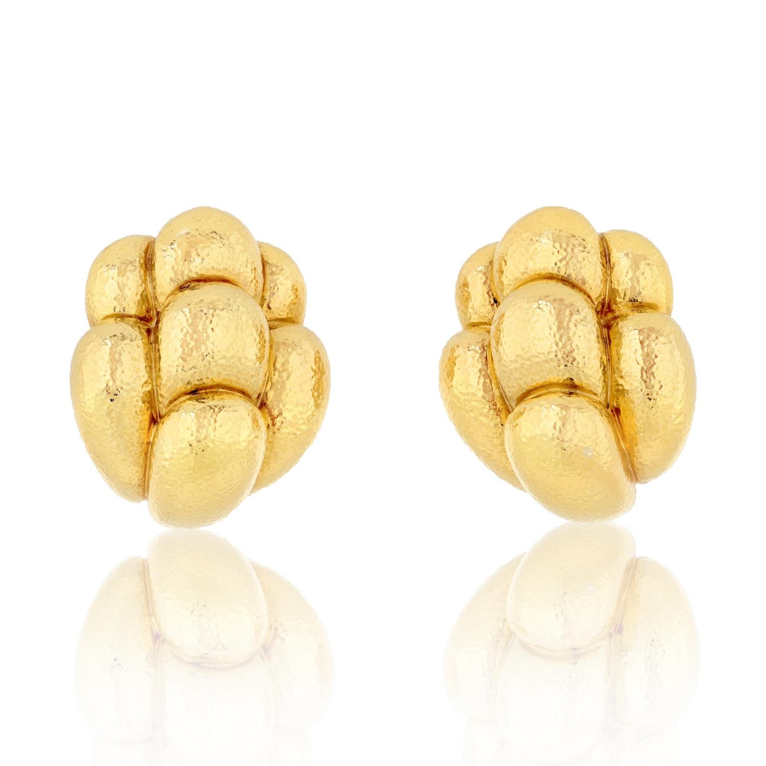 Indulge in the timeless allure of the David Webb 18K Yellow Gold Lobed Textured Clip Earrings, a captivating pair designed to enhance your style with sophistication and elegance.

**Key Features:**

1. **Material:**
   - Crafted in luxurious 18K