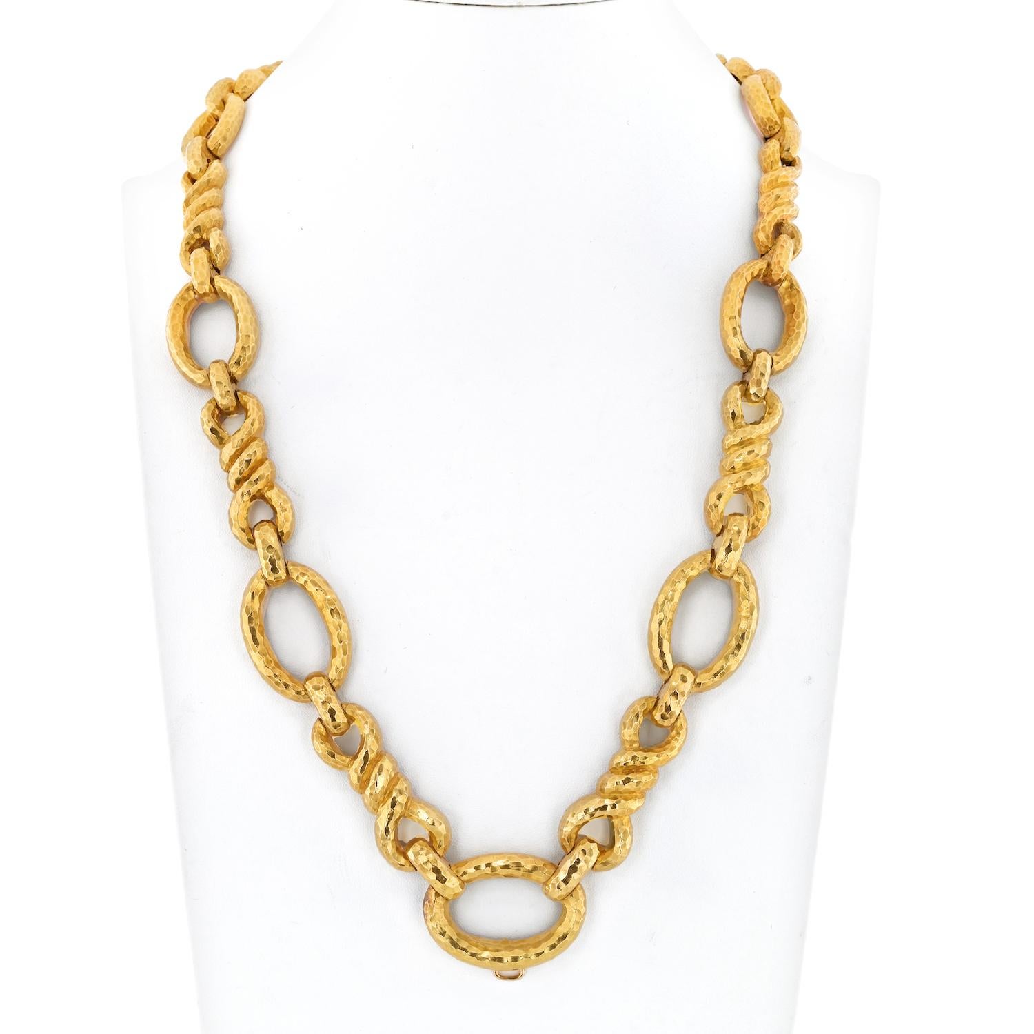 Introducing the striking David Webb Platinum & 18K Yellow Gold Open Link Hammered Necklace, a true testament to the brand's exceptional craftsmanship and innovative design. This necklace exudes timeless elegance and versatility, offering a stunning